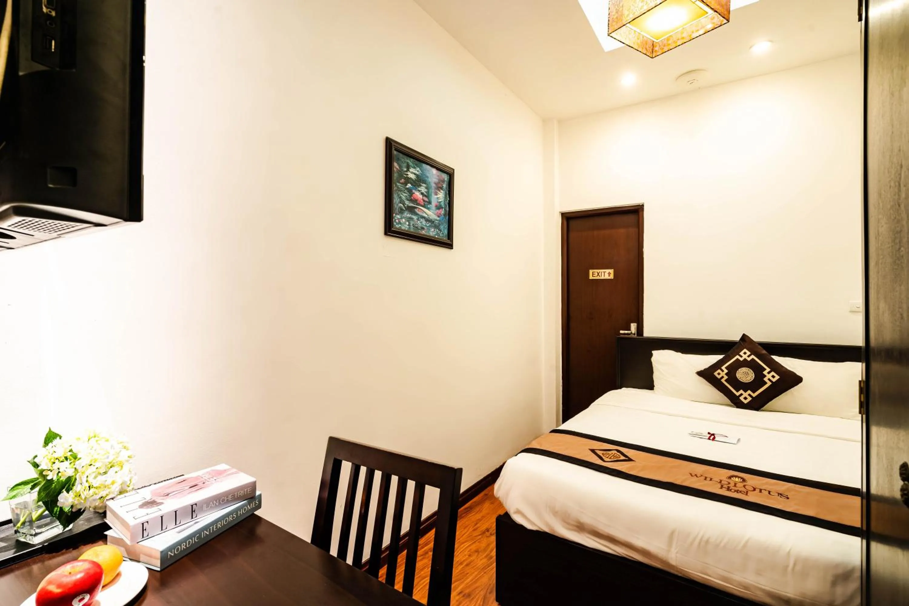 Bed in Wild Lotus Hotel & Travel 2