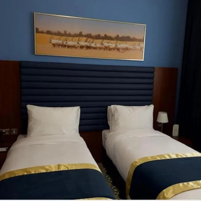 Bed in BANIYAS PLAZA HOTEL APARTMENTS