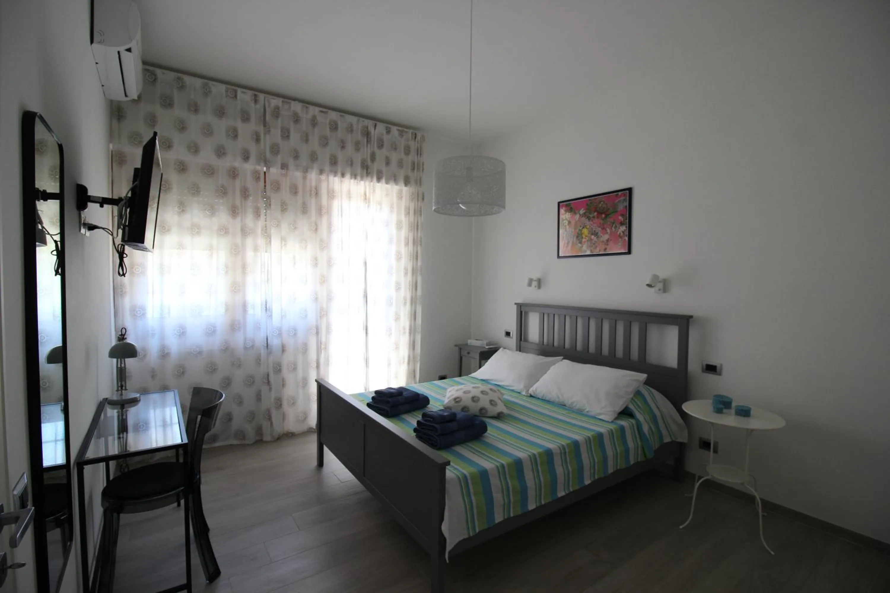 TV and multimedia, Bed in Appartamento Lungomare Toscanelli