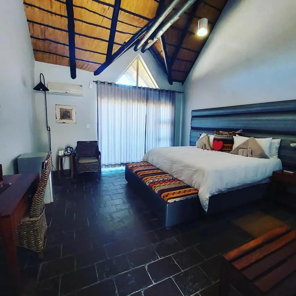 View (from property/room), Bed in Opuwo Country Lodge