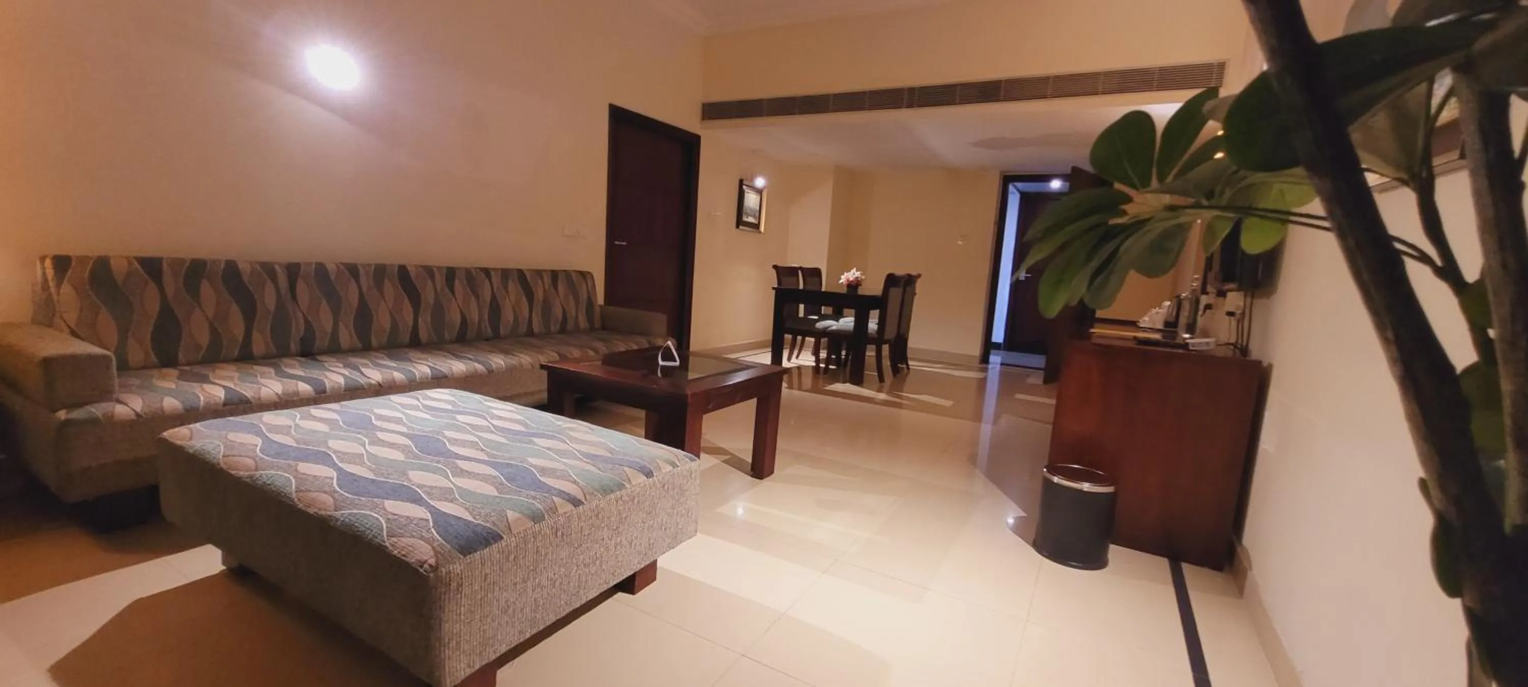 Seating area, Bed in ASHOKA INN