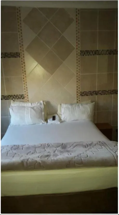 Bed in Legacy Guest Lodge