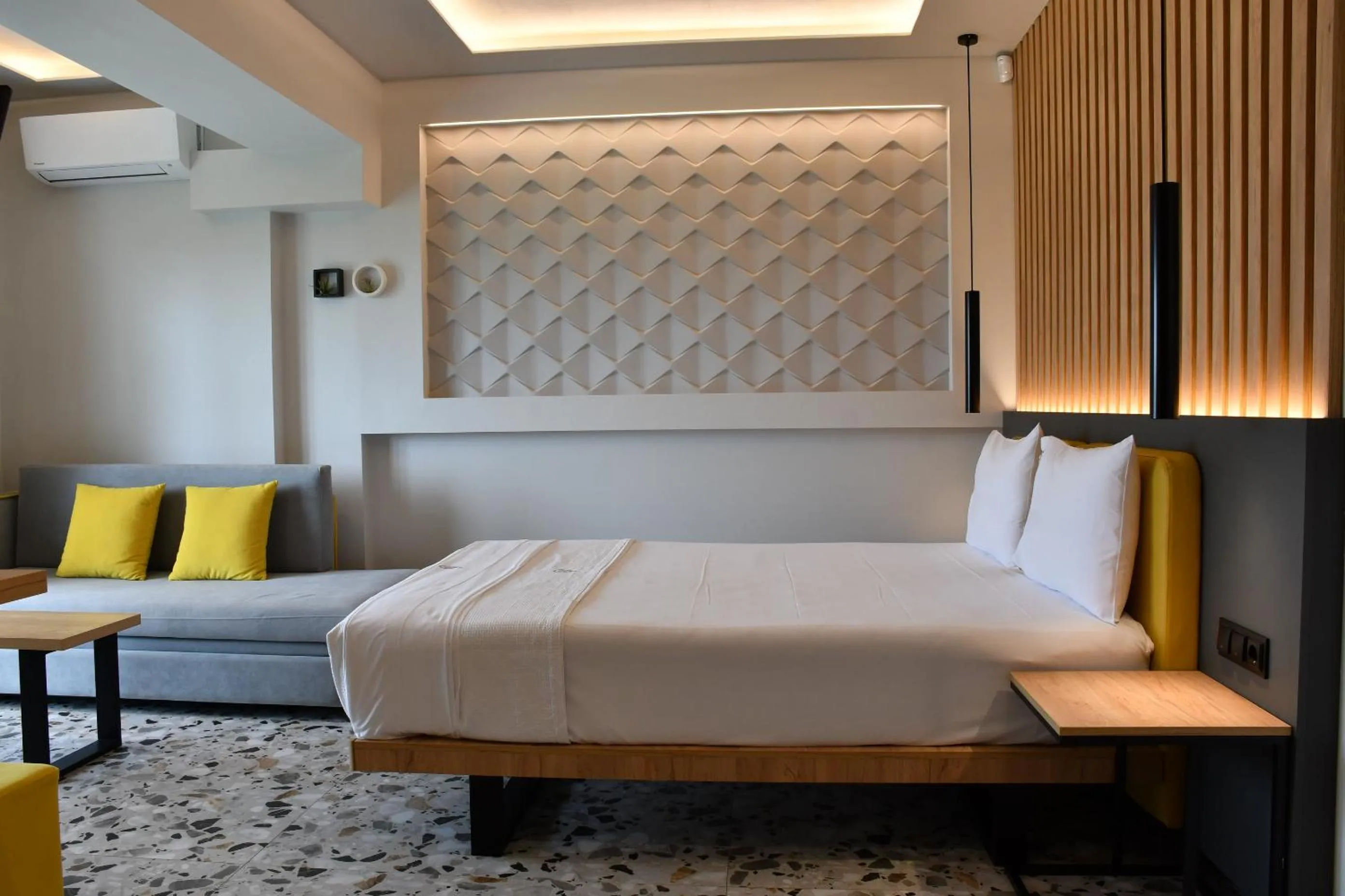 Bed in NERO SEASCAPE SUITES