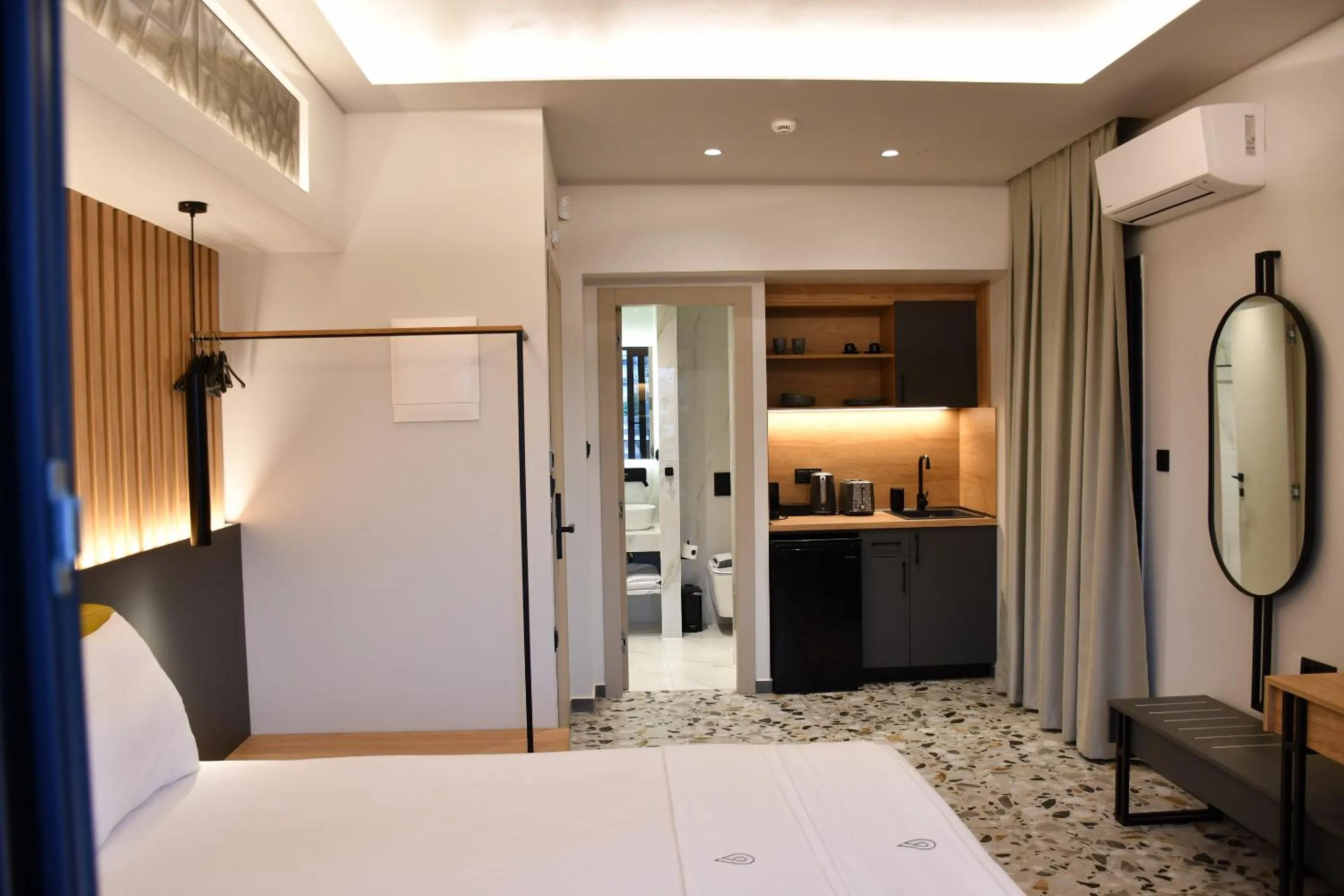 Bed in NERO SEASCAPE SUITES