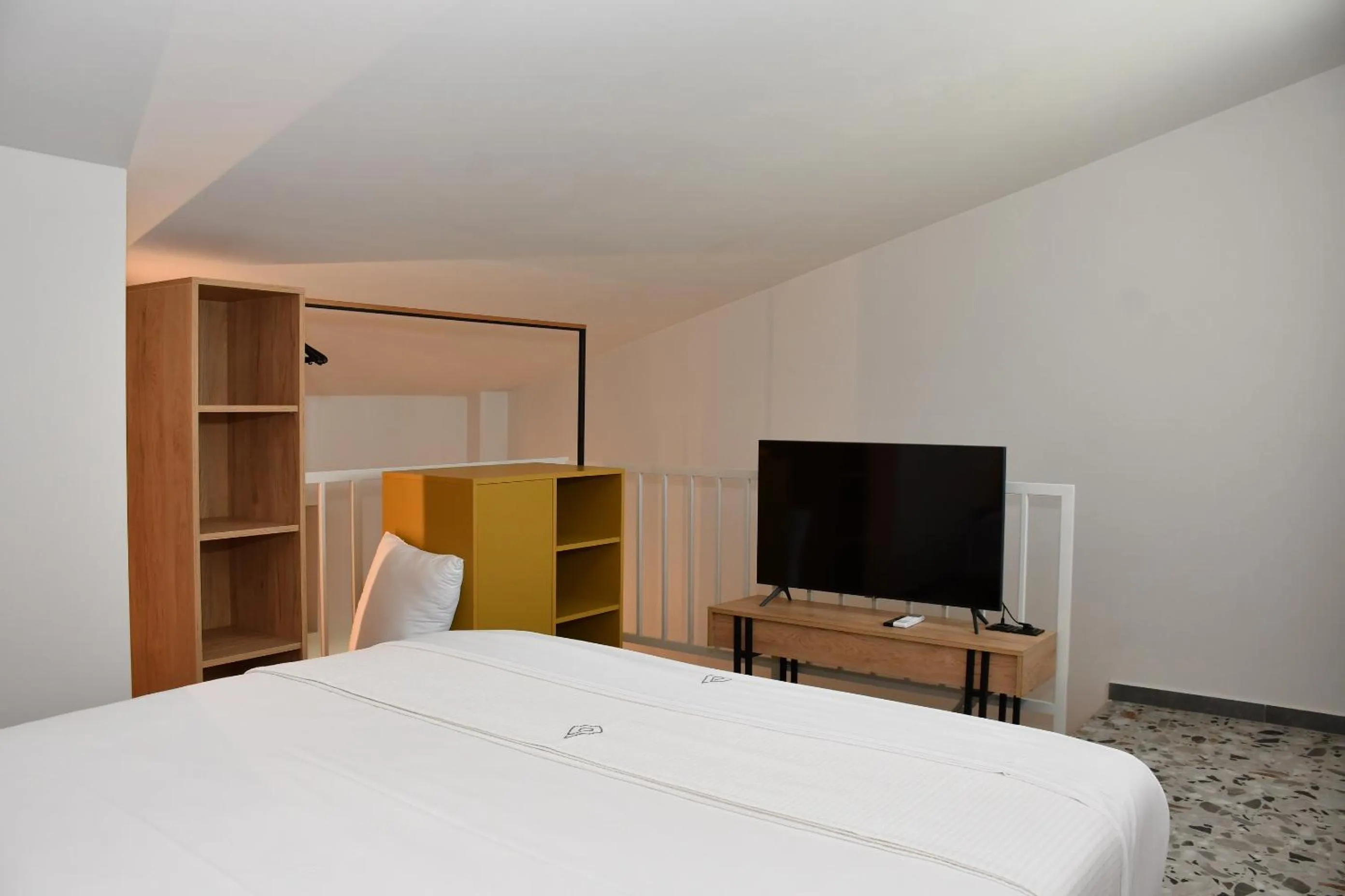 Bed in NERO SEASCAPE SUITES