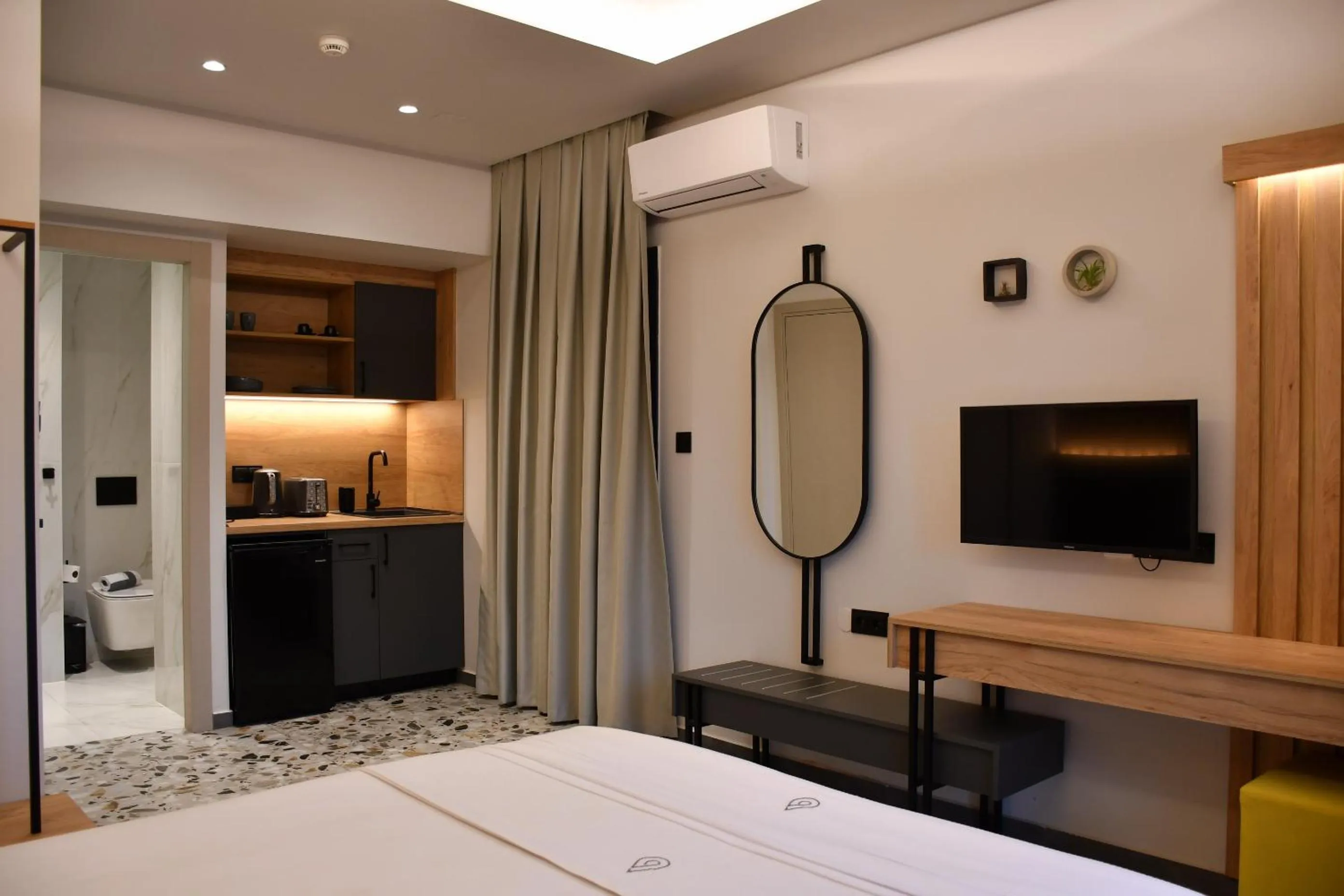 Bed in NERO SEASCAPE SUITES