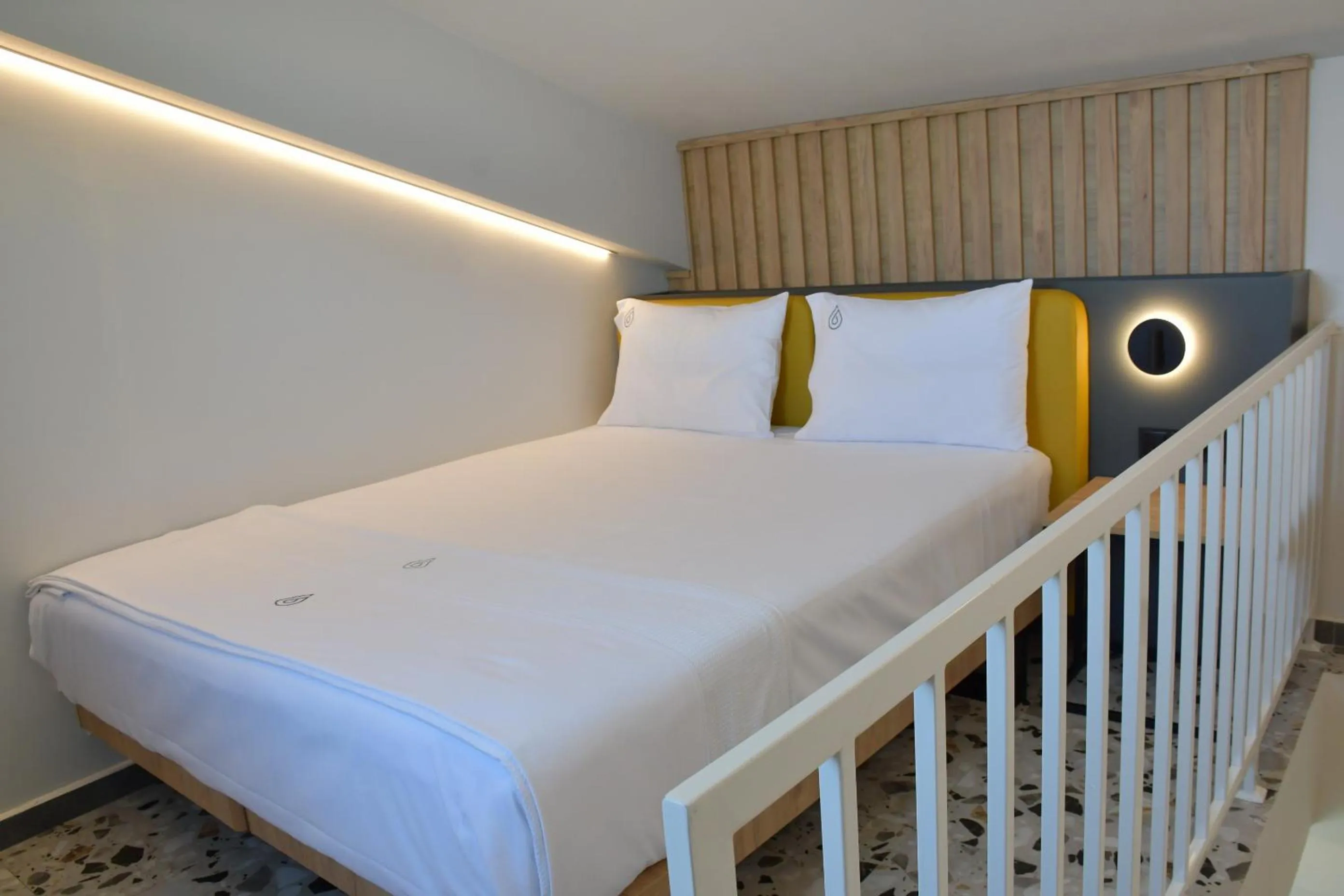 Bed in NERO SEASCAPE SUITES