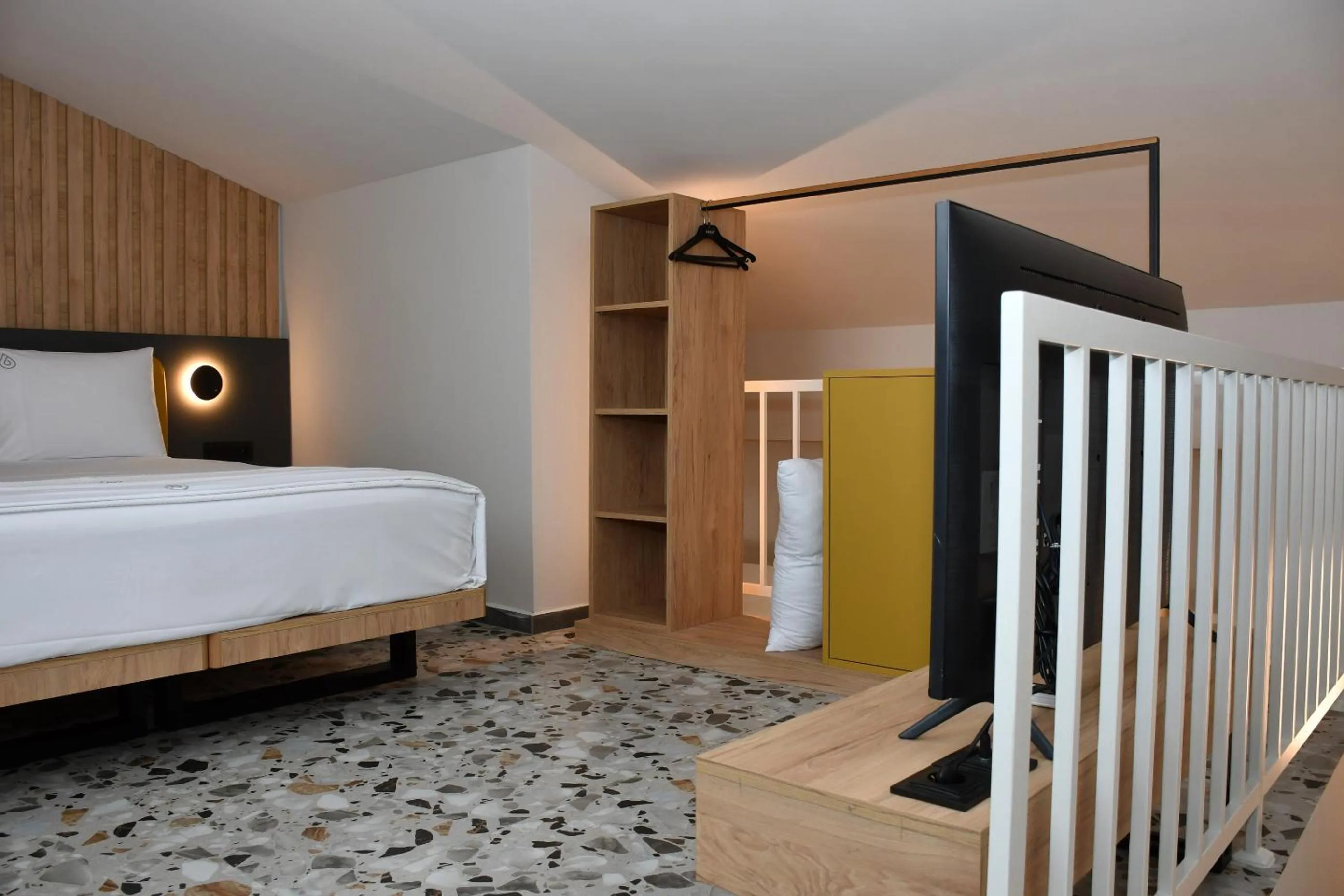 Bed in NERO SEASCAPE SUITES