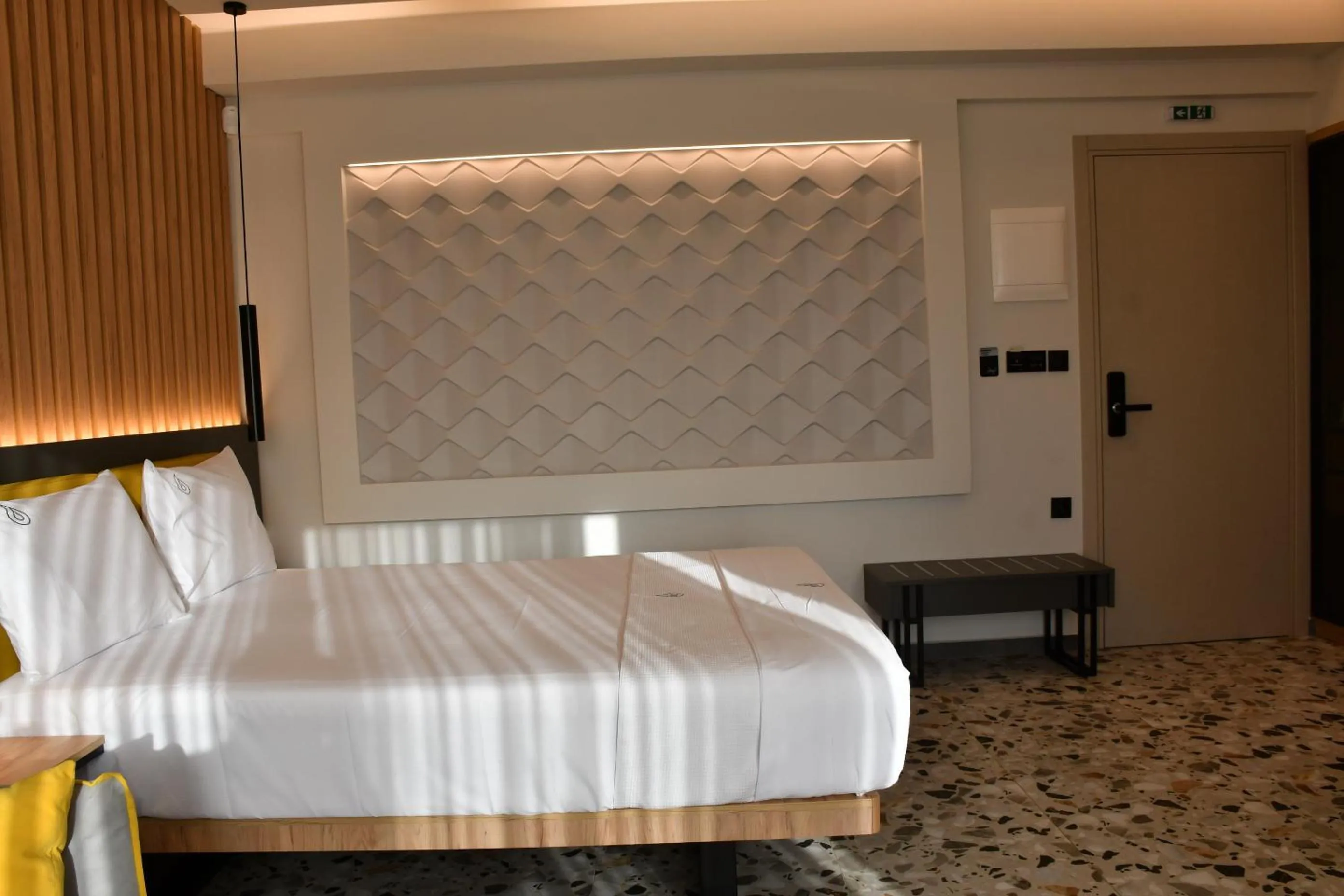 Bed in NERO SEASCAPE SUITES