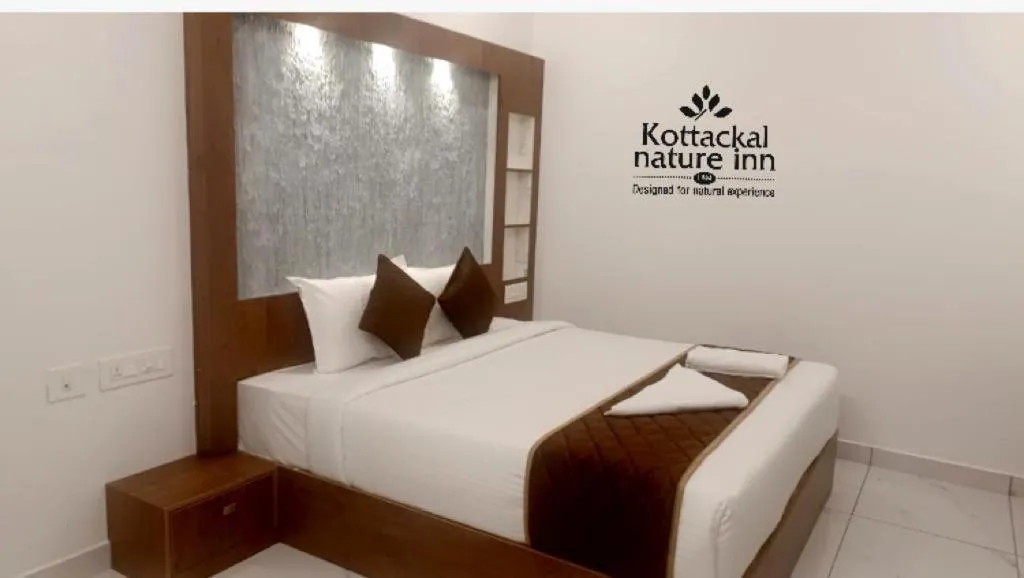 Bed in KOTTACKAL NATURE INN