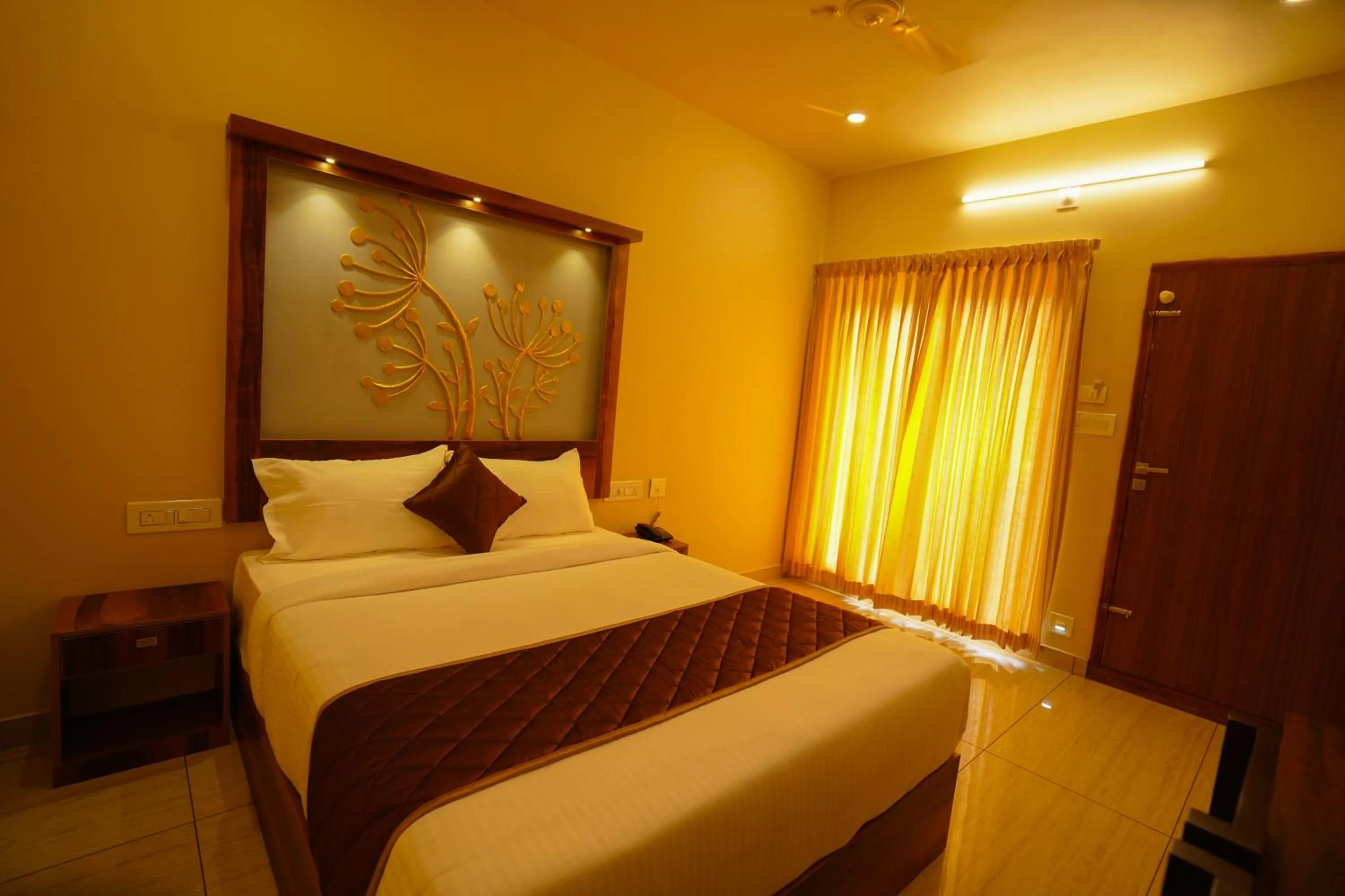 Bed in KOTTACKAL NATURE INN