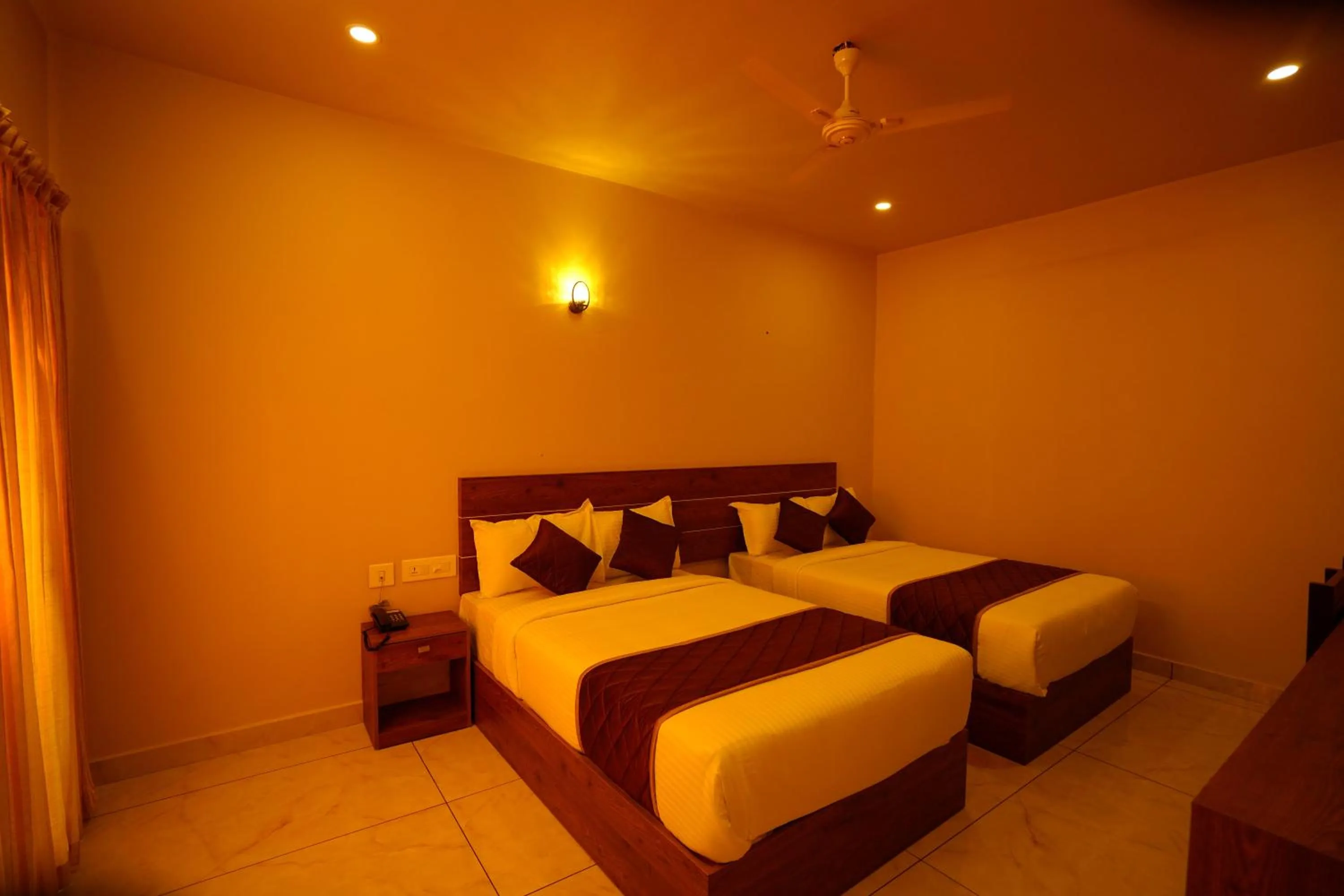 Bed in KOTTACKAL NATURE INN