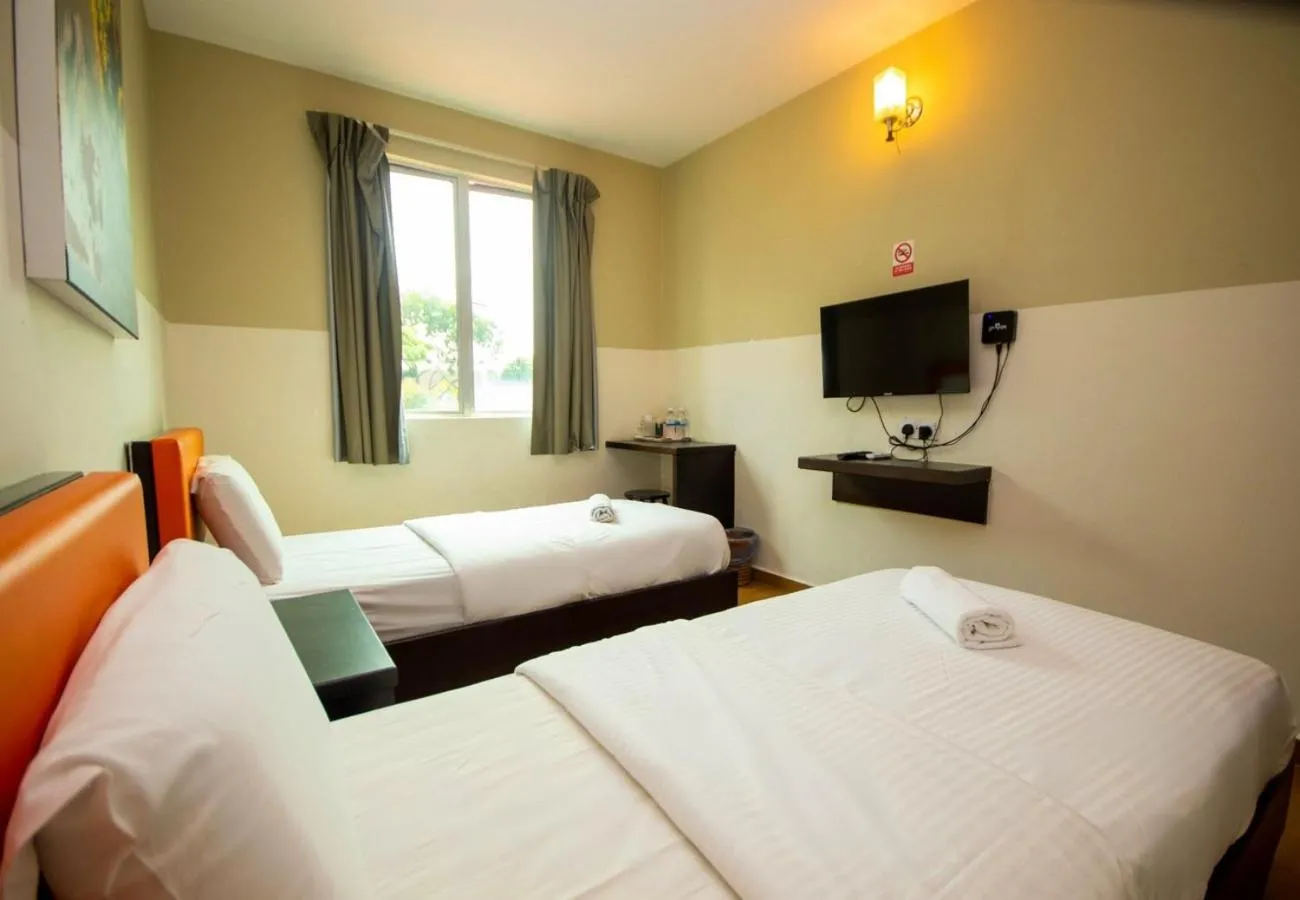 Bed in JQ Suria Hotel