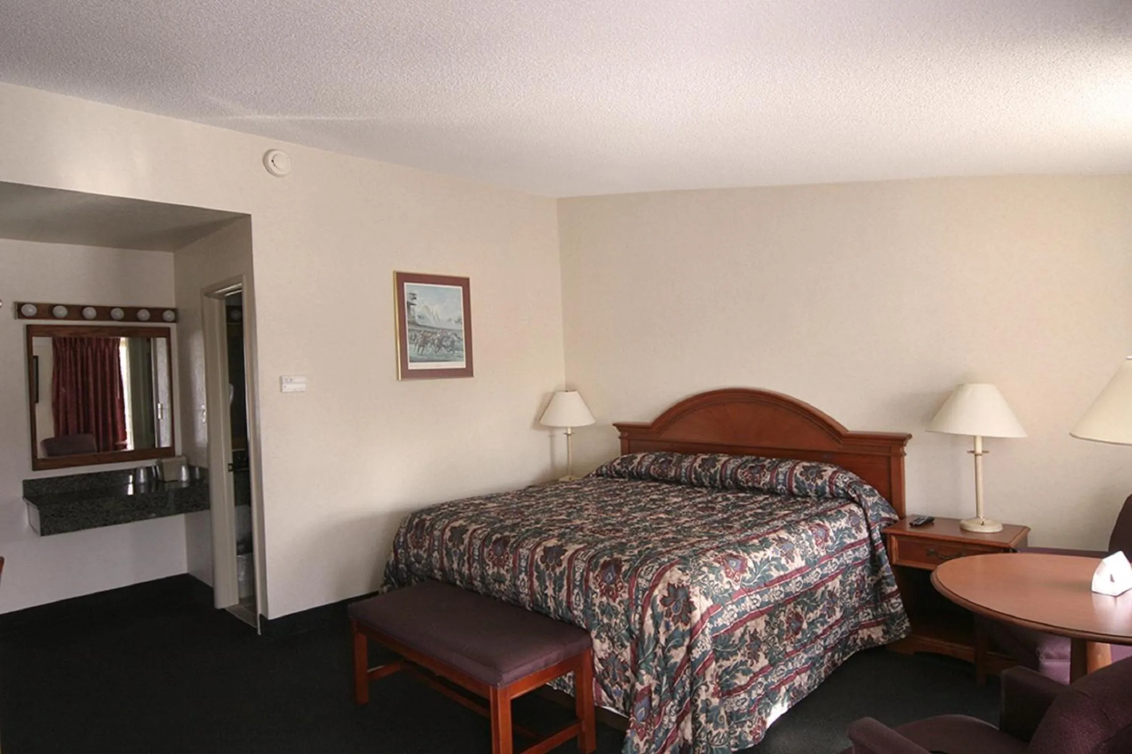 Bed in Landmark Motor Inn