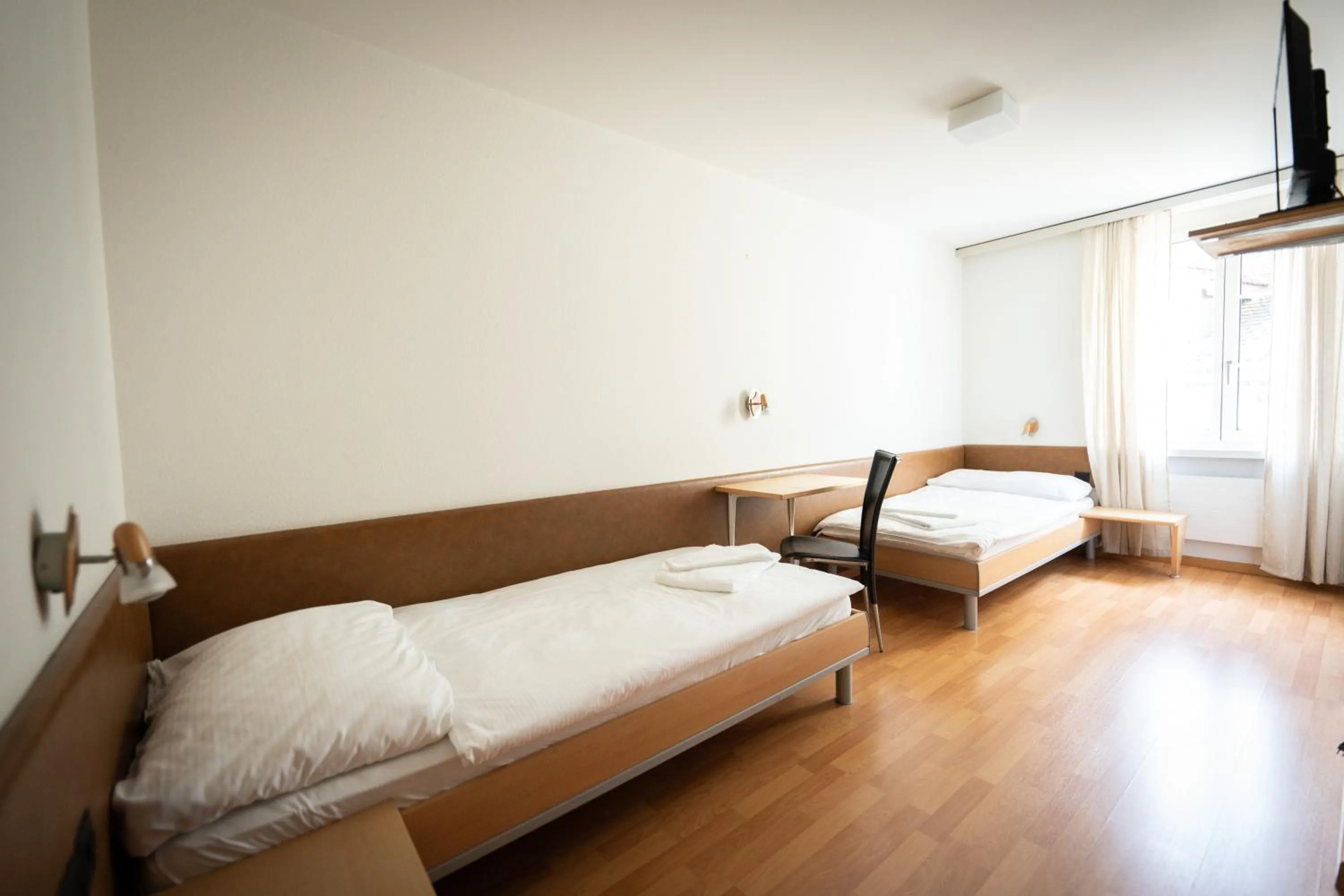 Bed in Hotel Stadthof Glarus