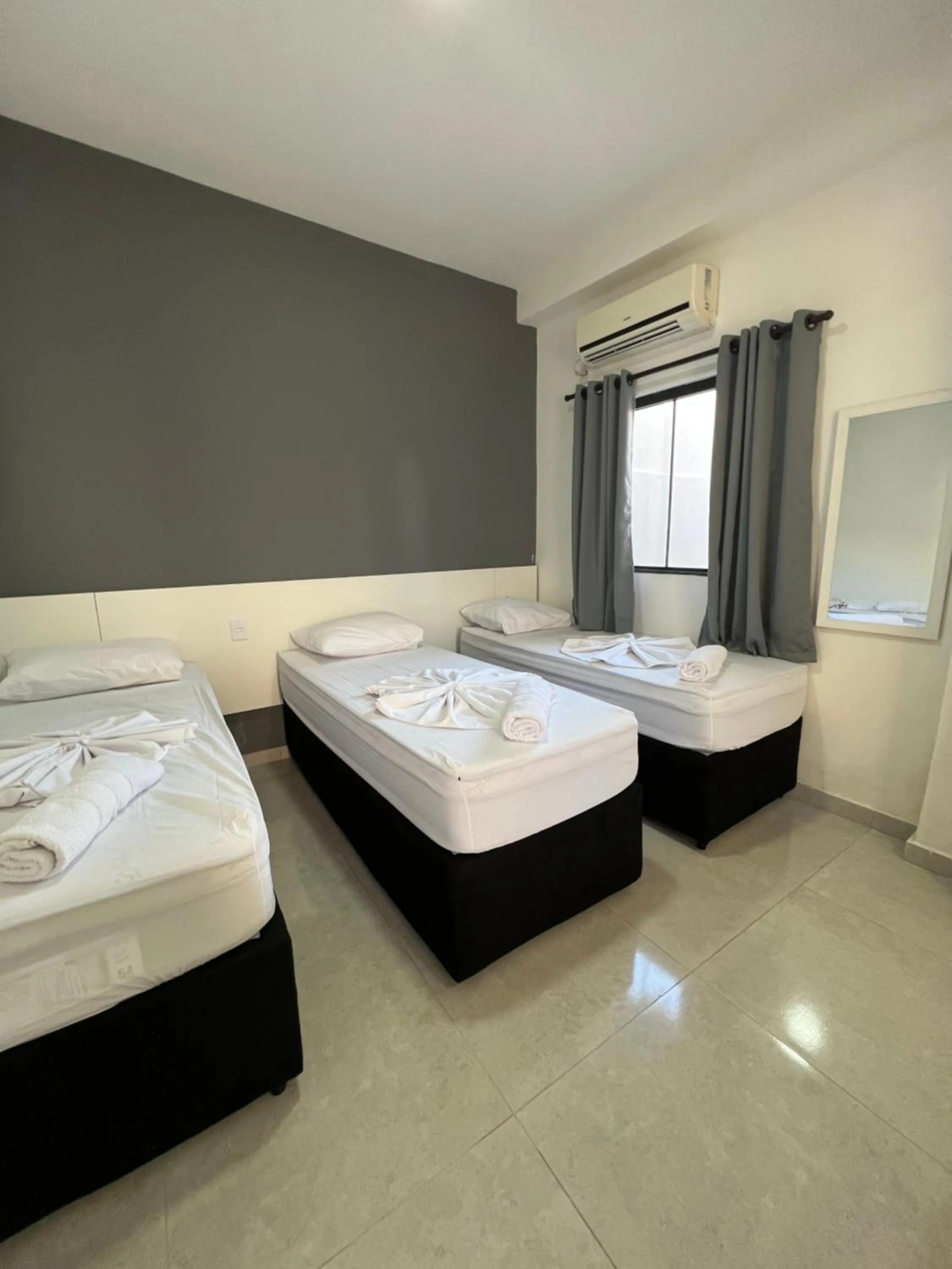 Bed in Hotel Pousada Colliseu