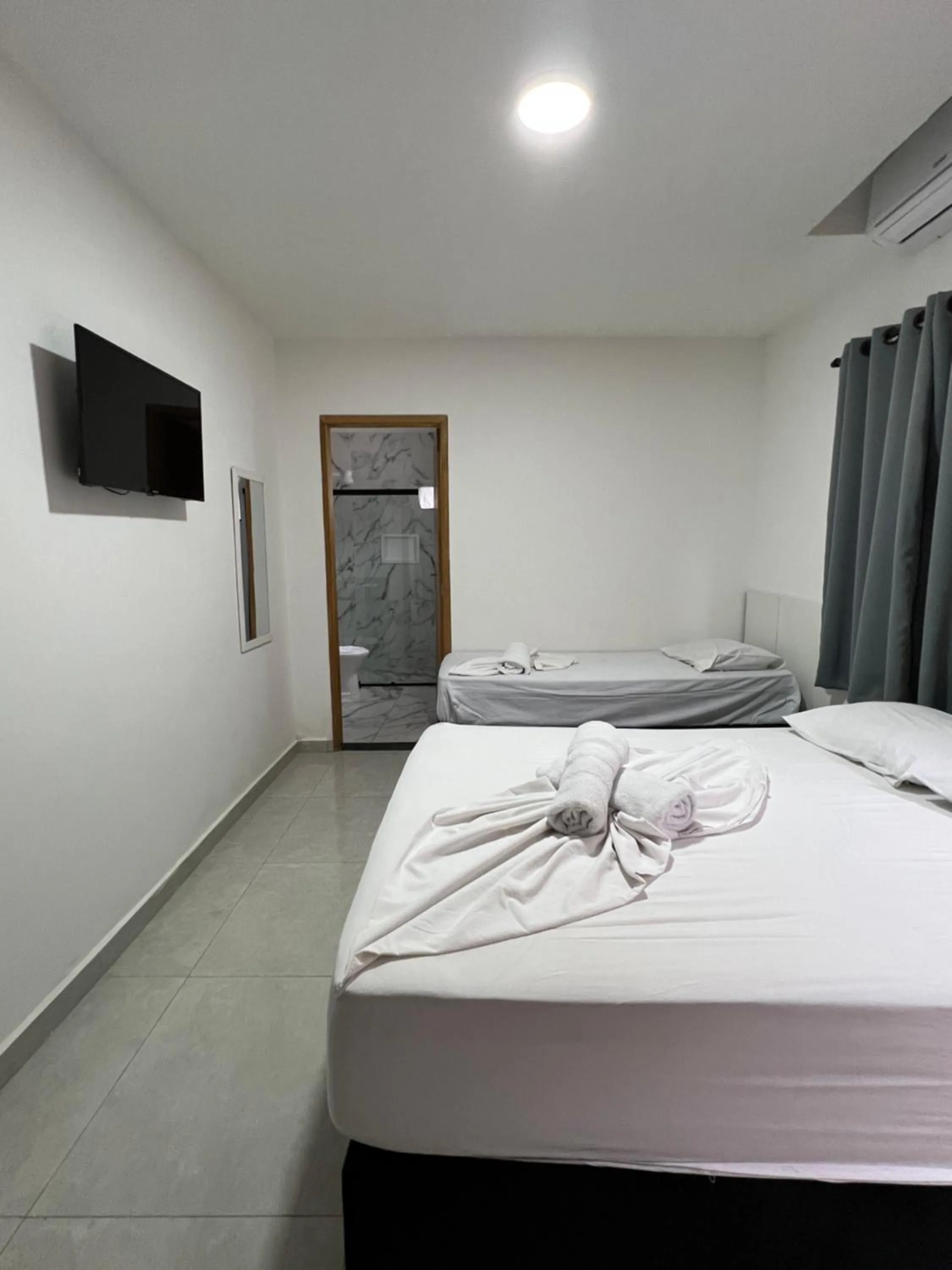 Bed in Hotel Pousada Colliseu