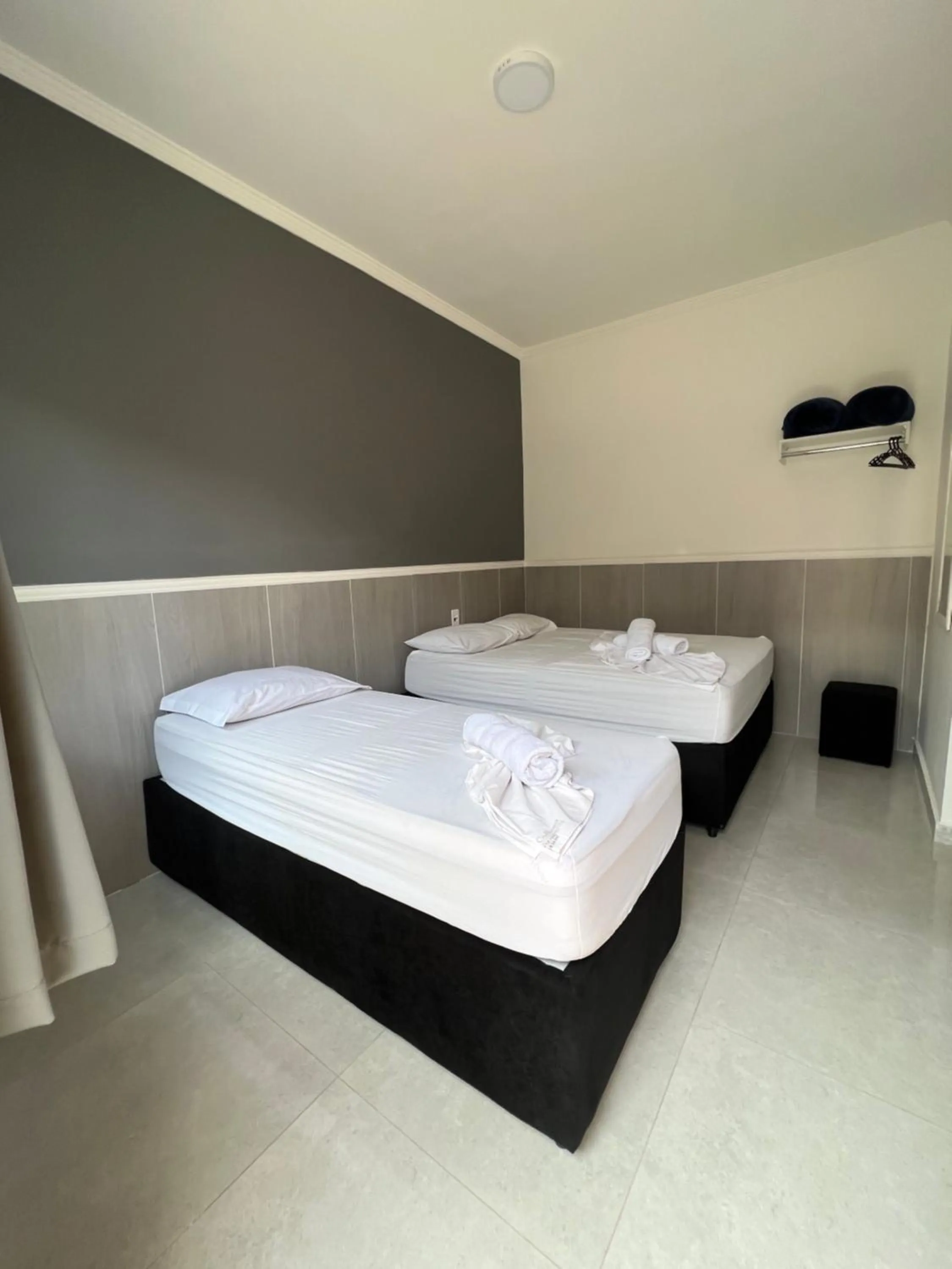 Bed in Hotel Pousada Colliseu