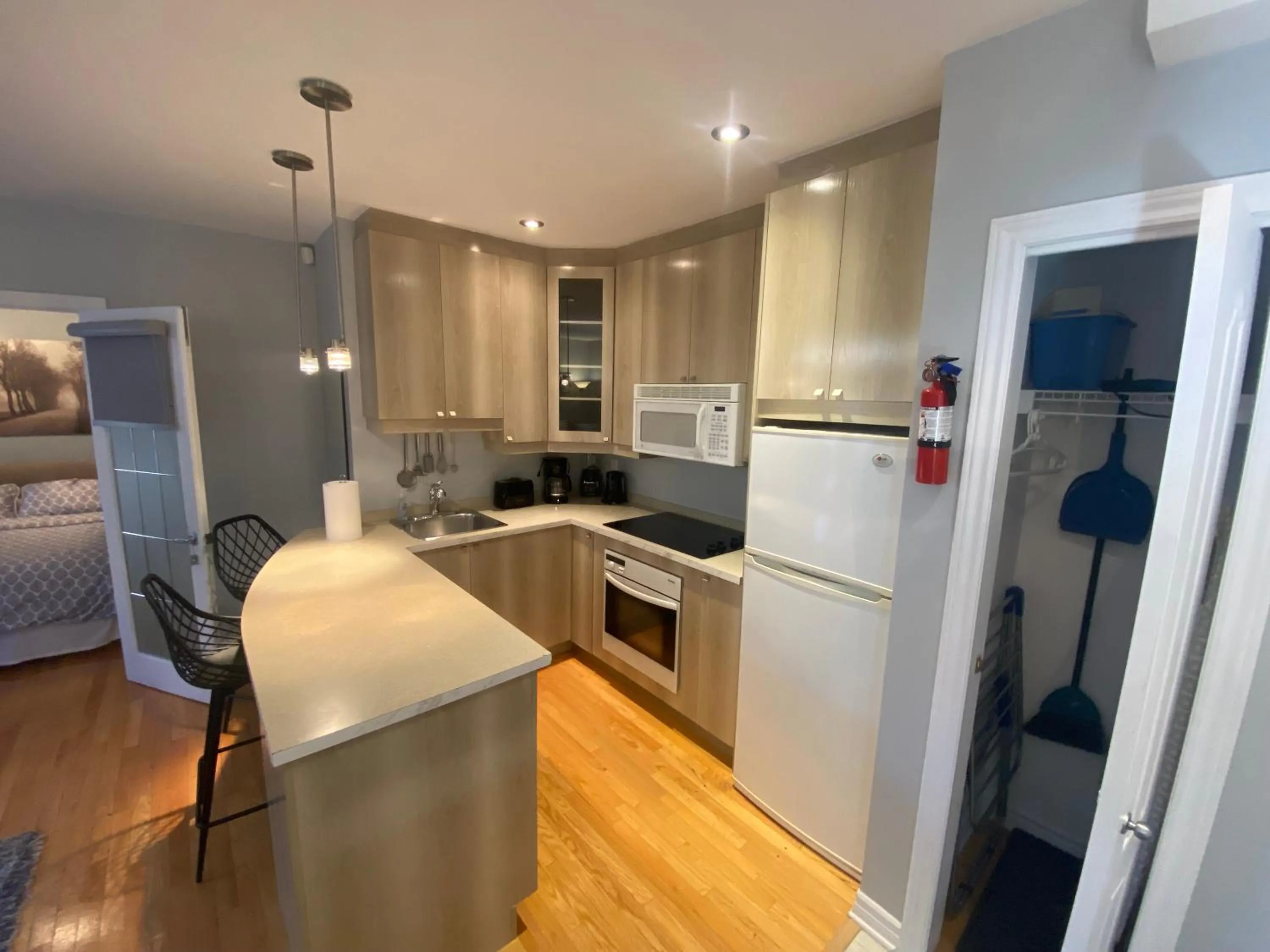 Kitchen or kitchenette in ApartHotelMontreal by Les Terrasses Saint Urbain 2225I2