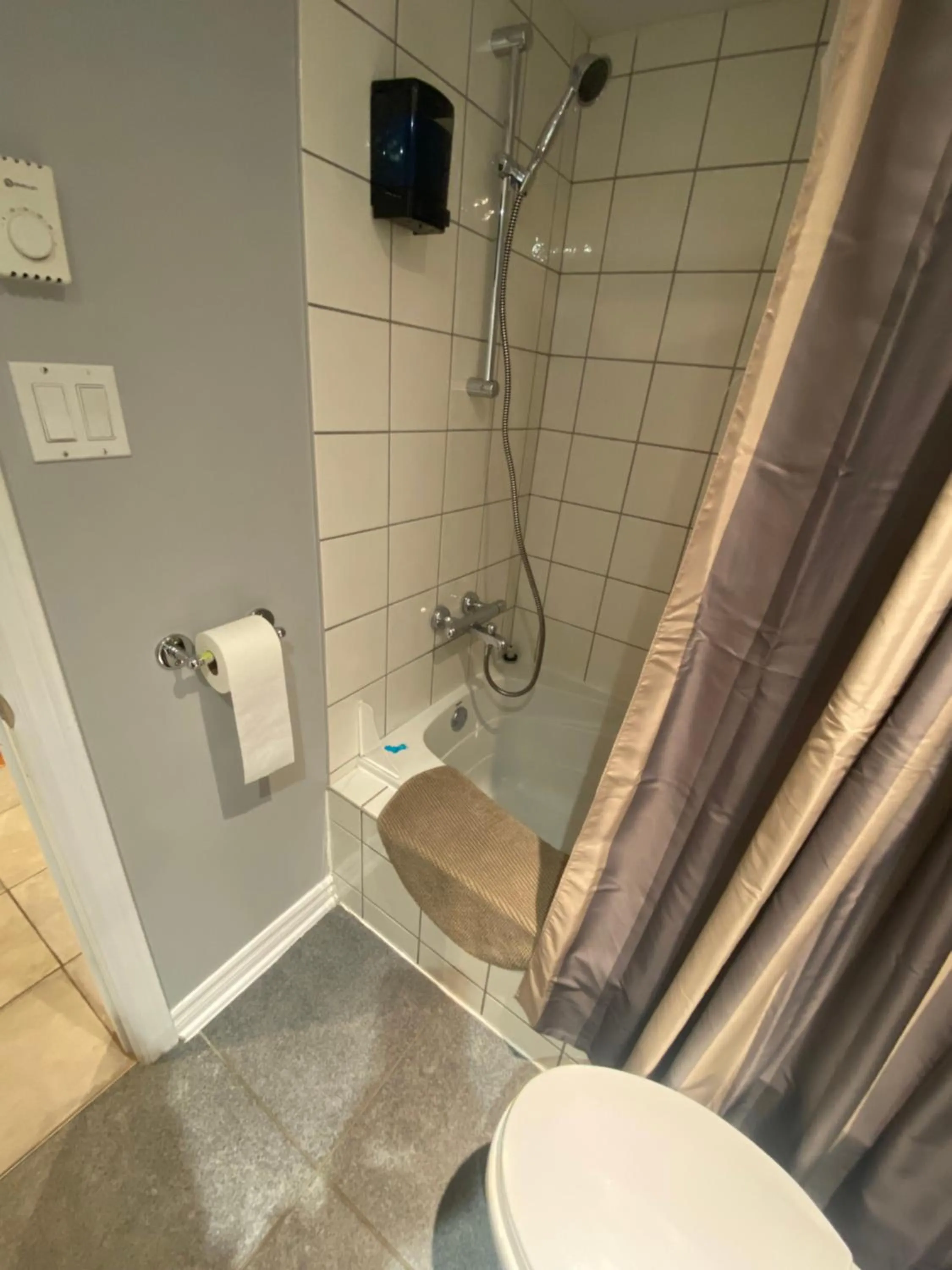 Shower in ApartHotelMontreal by Les Terrasses Saint Urbain 2225I2