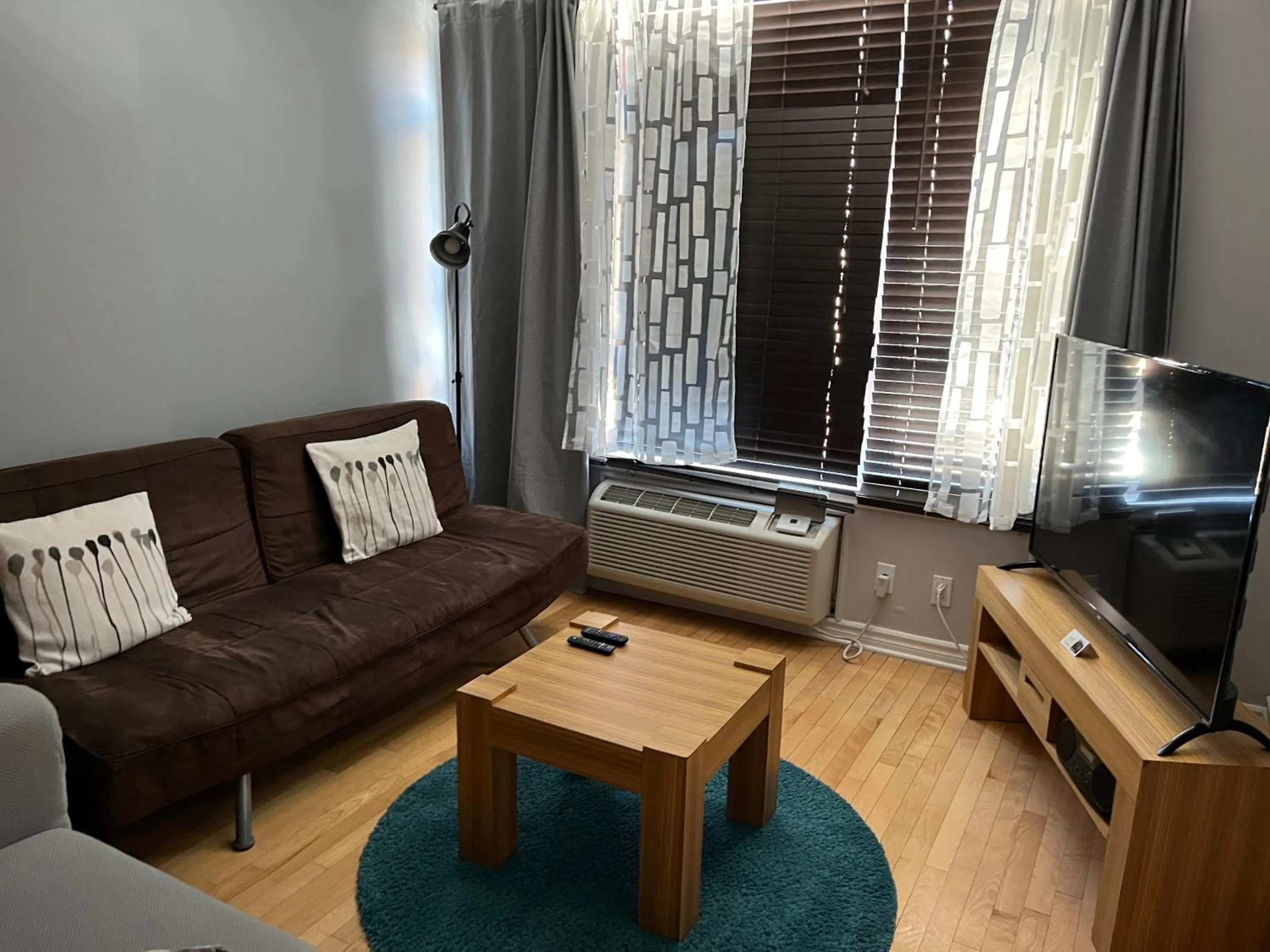 Living room in ApartHotelMontreal by Les Terrasses Saint Urbain 2225I2