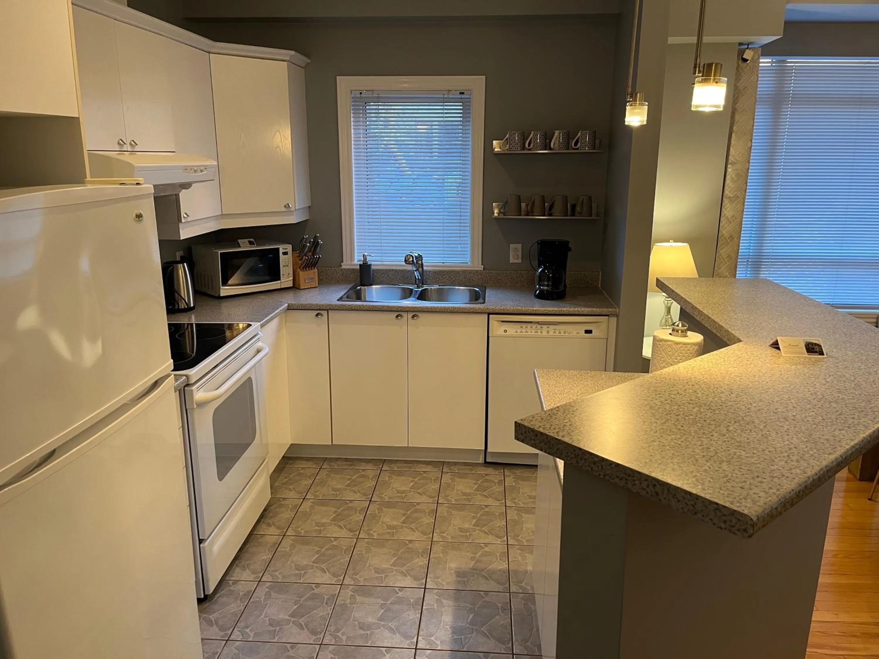 kitchen in ApartHotelMontreal by Les Terrasses Saint Urbain 2225I2