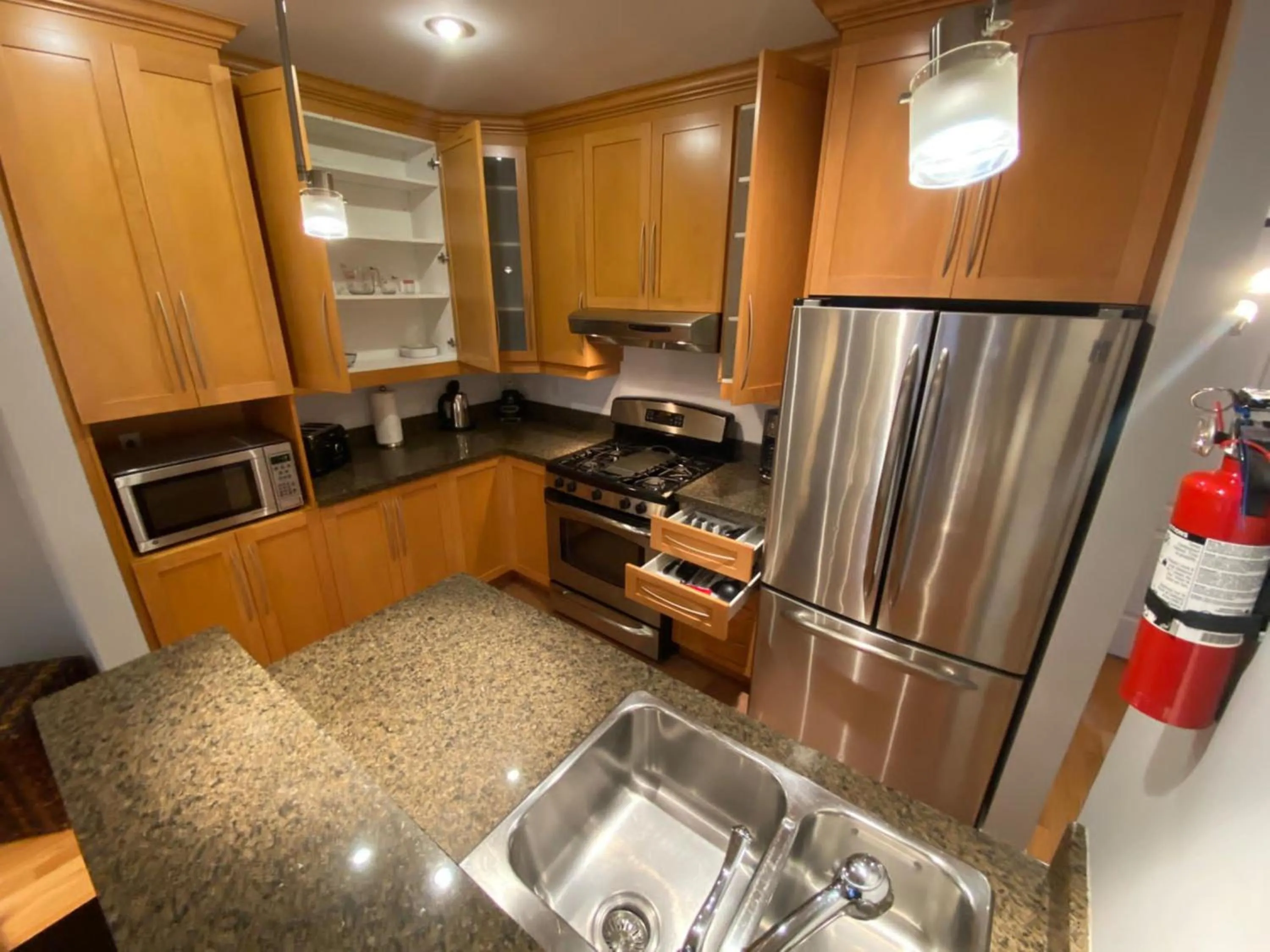 Kitchen or kitchenette in ApartHotelMontreal by Les Terrasses Saint Urbain 2225I2