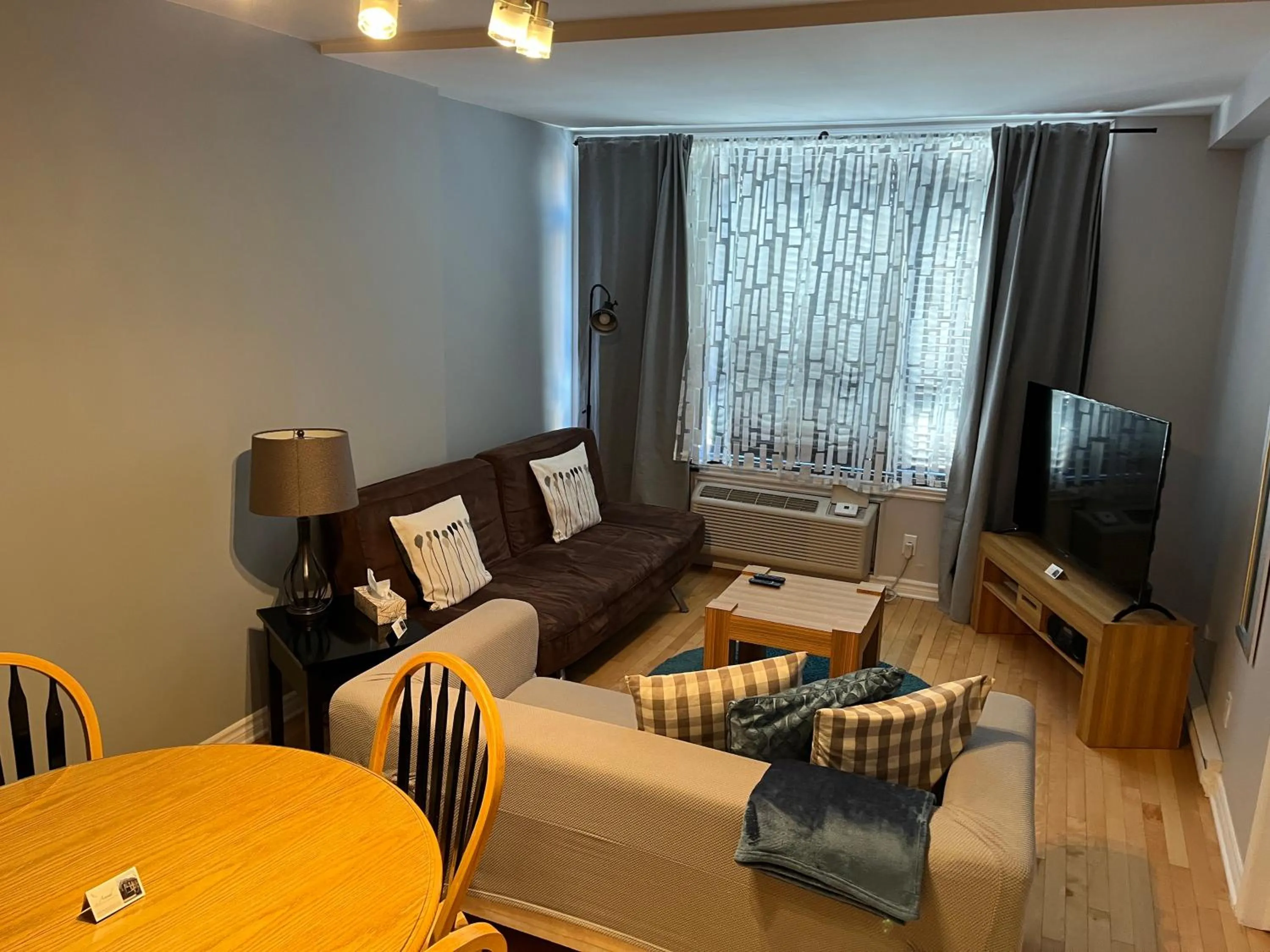 Living room in ApartHotelMontreal by Les Terrasses Saint Urbain 2225I2