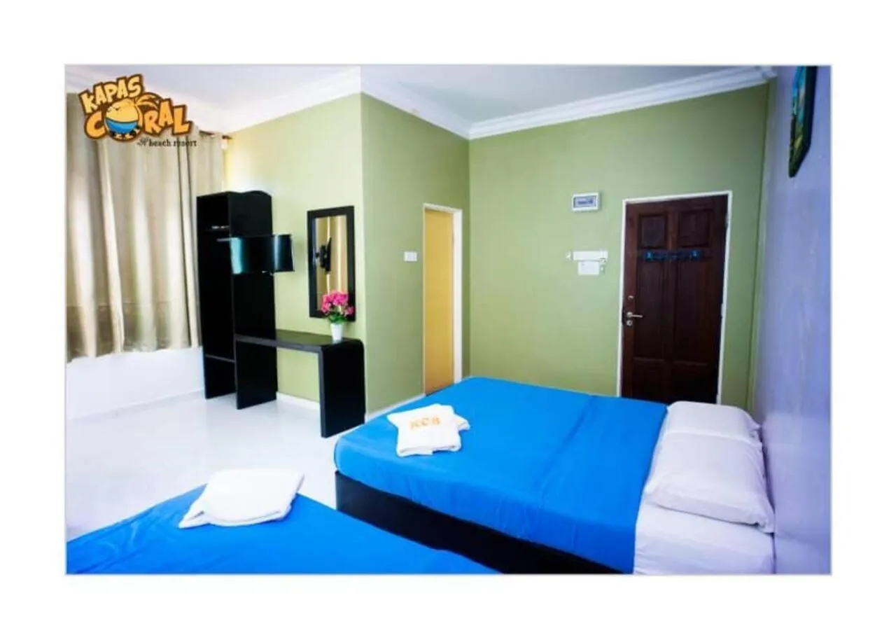 Bed in Kapas Coral Beach Resort