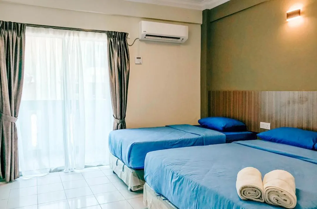 Bed in Kapas Coral Beach Resort