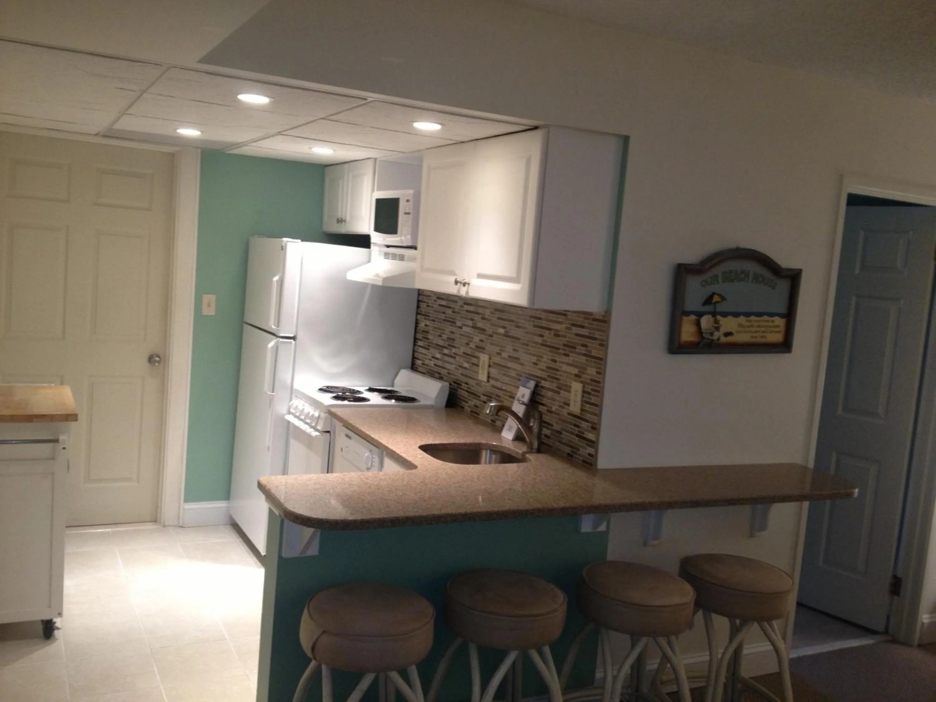 Kitchen or kitchenette in Biscayne Suites