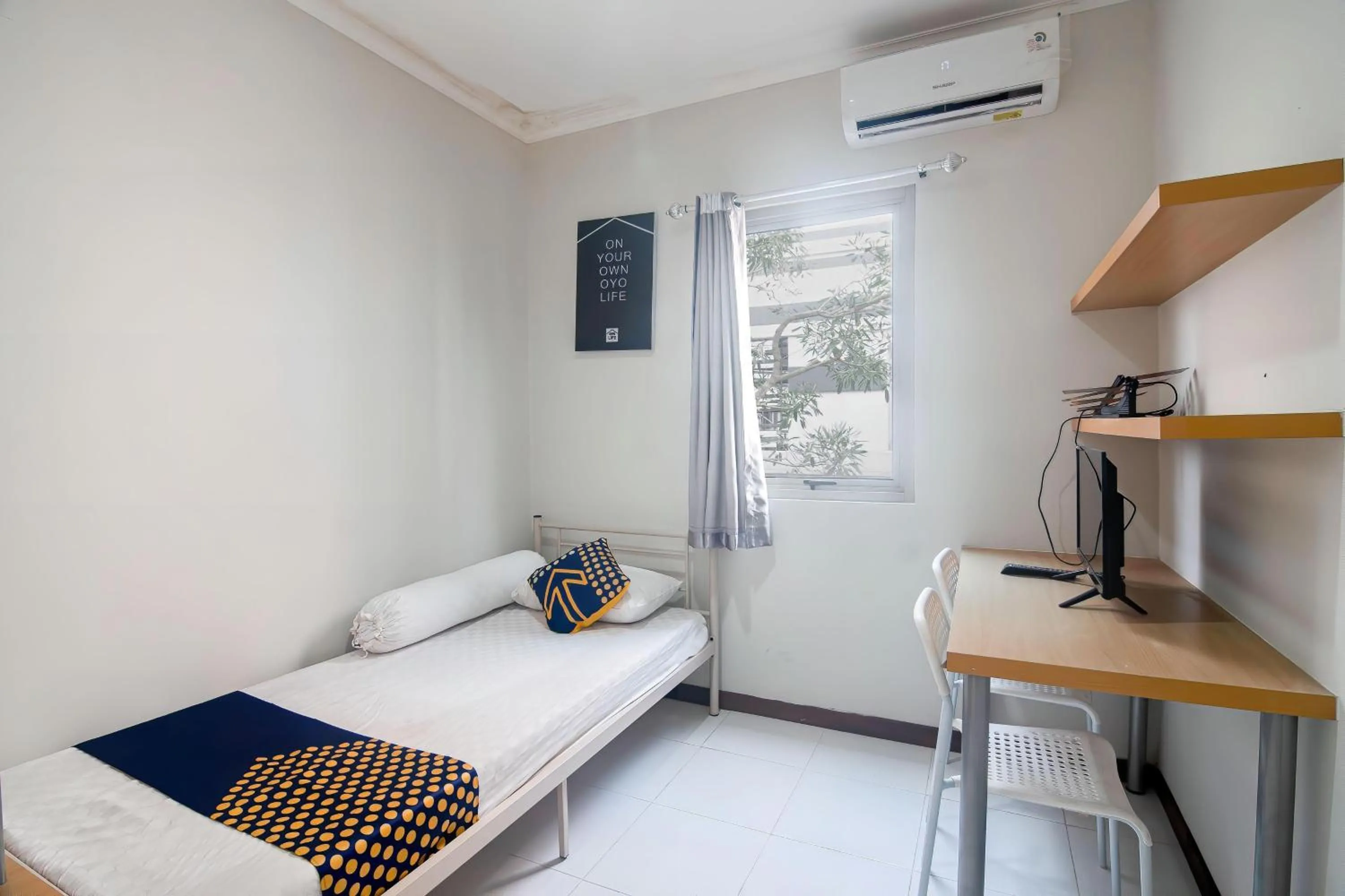 Bedroom in Hotel O Anartha Residence