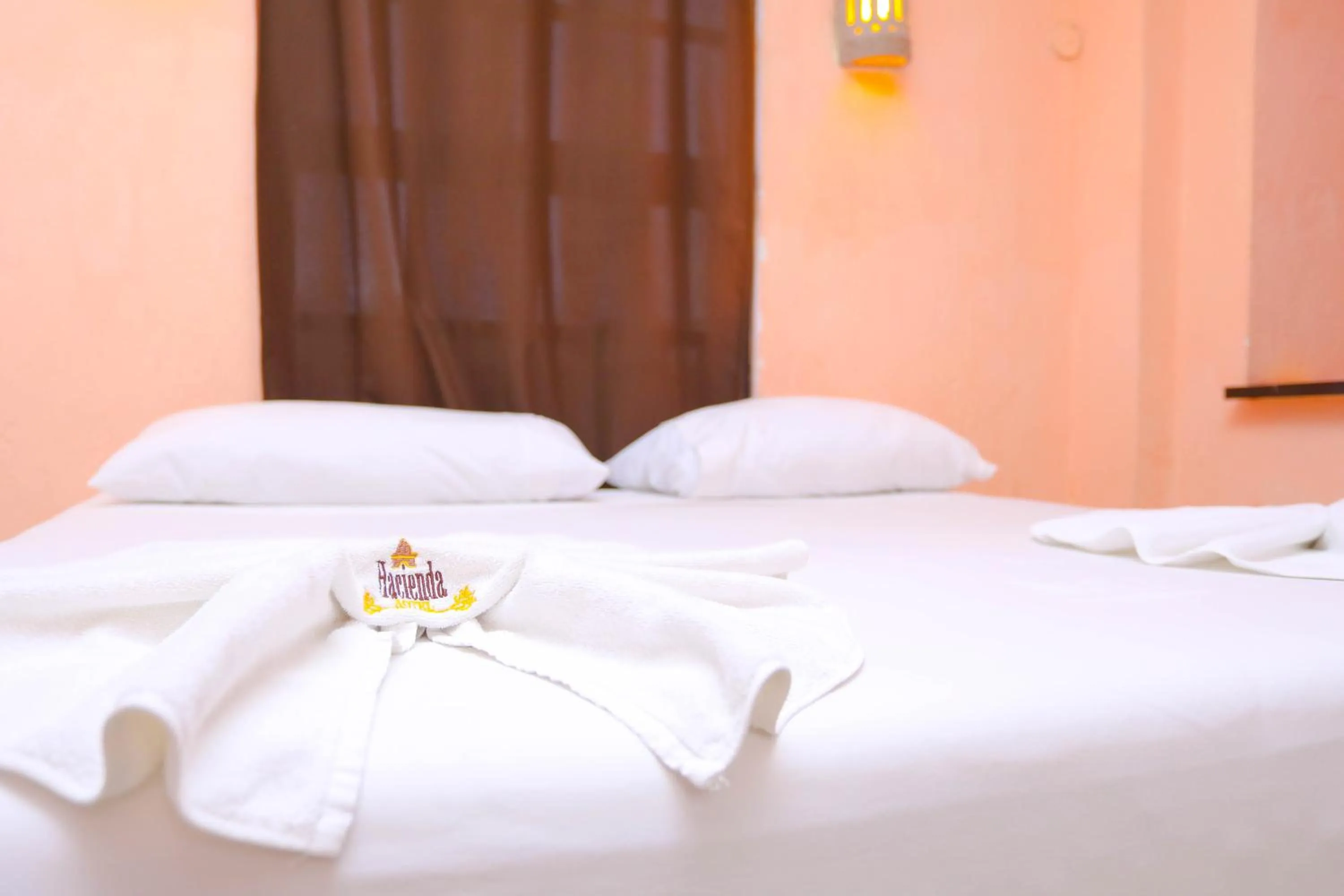 towels, Bed in Hotel Hacienda Cancun