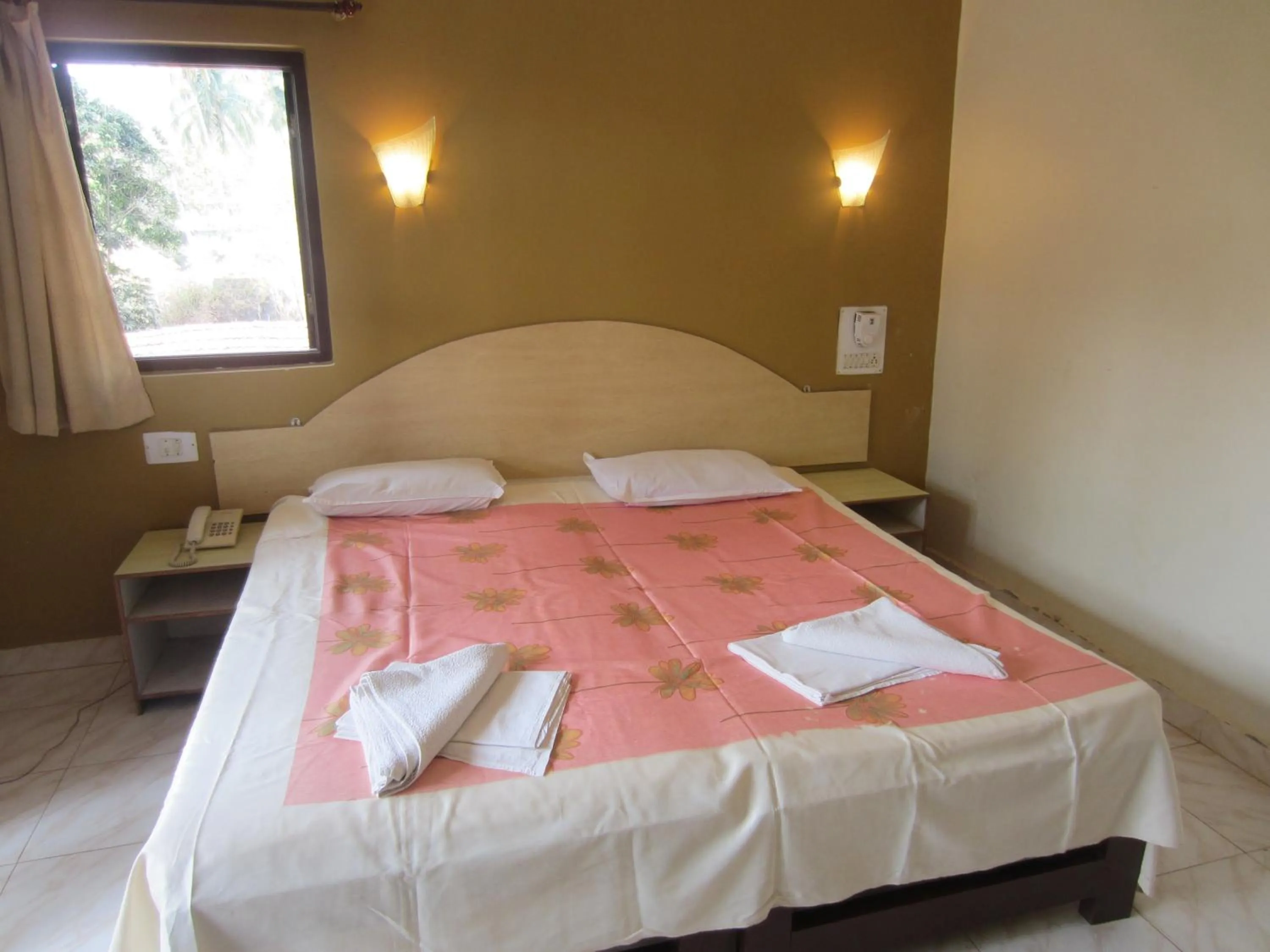 Bed in Riverside Regency Resort