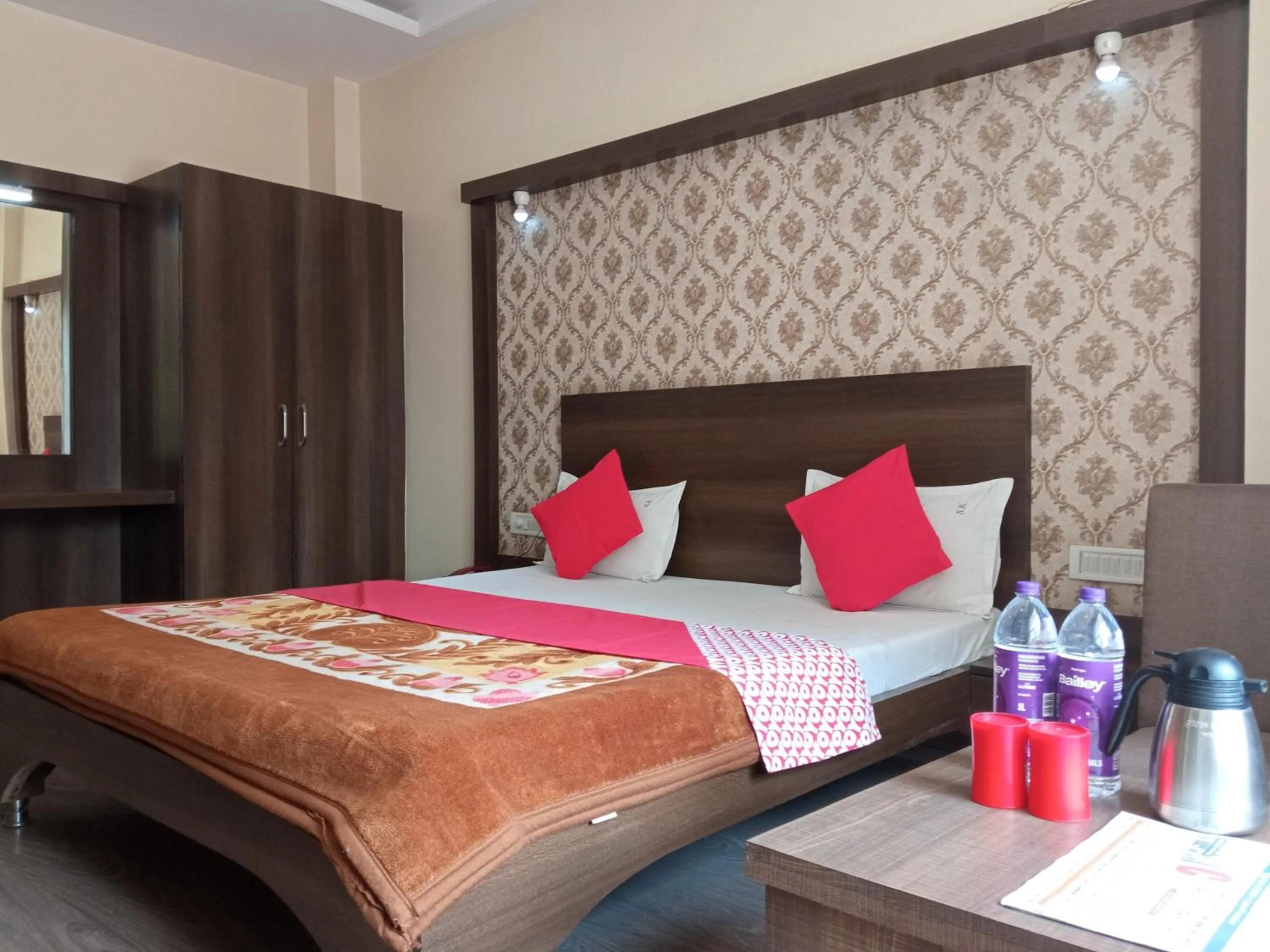 Bed in Pachmarhi Shri Krishna Hotel