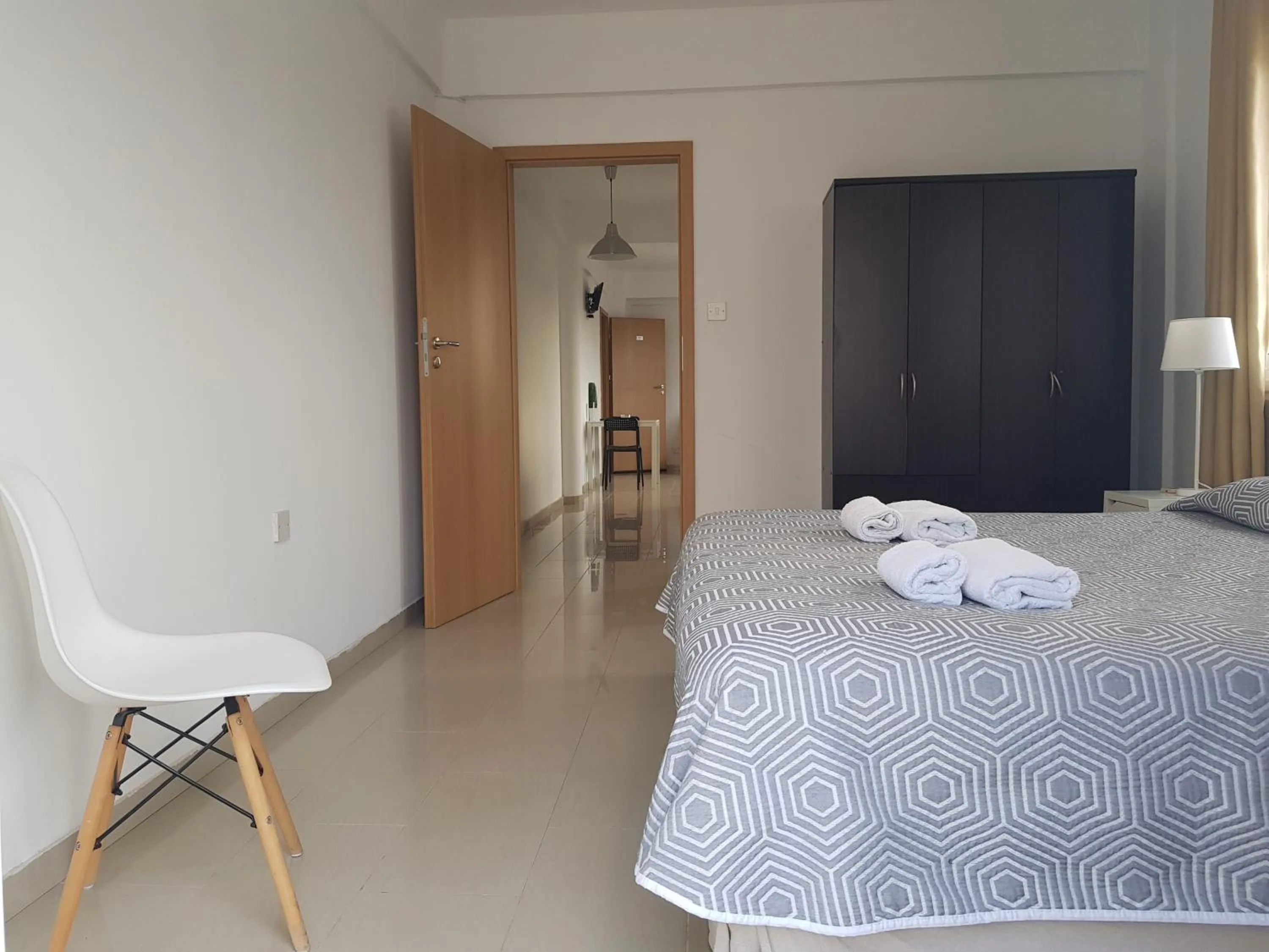 Bed in Valentinos Apartments