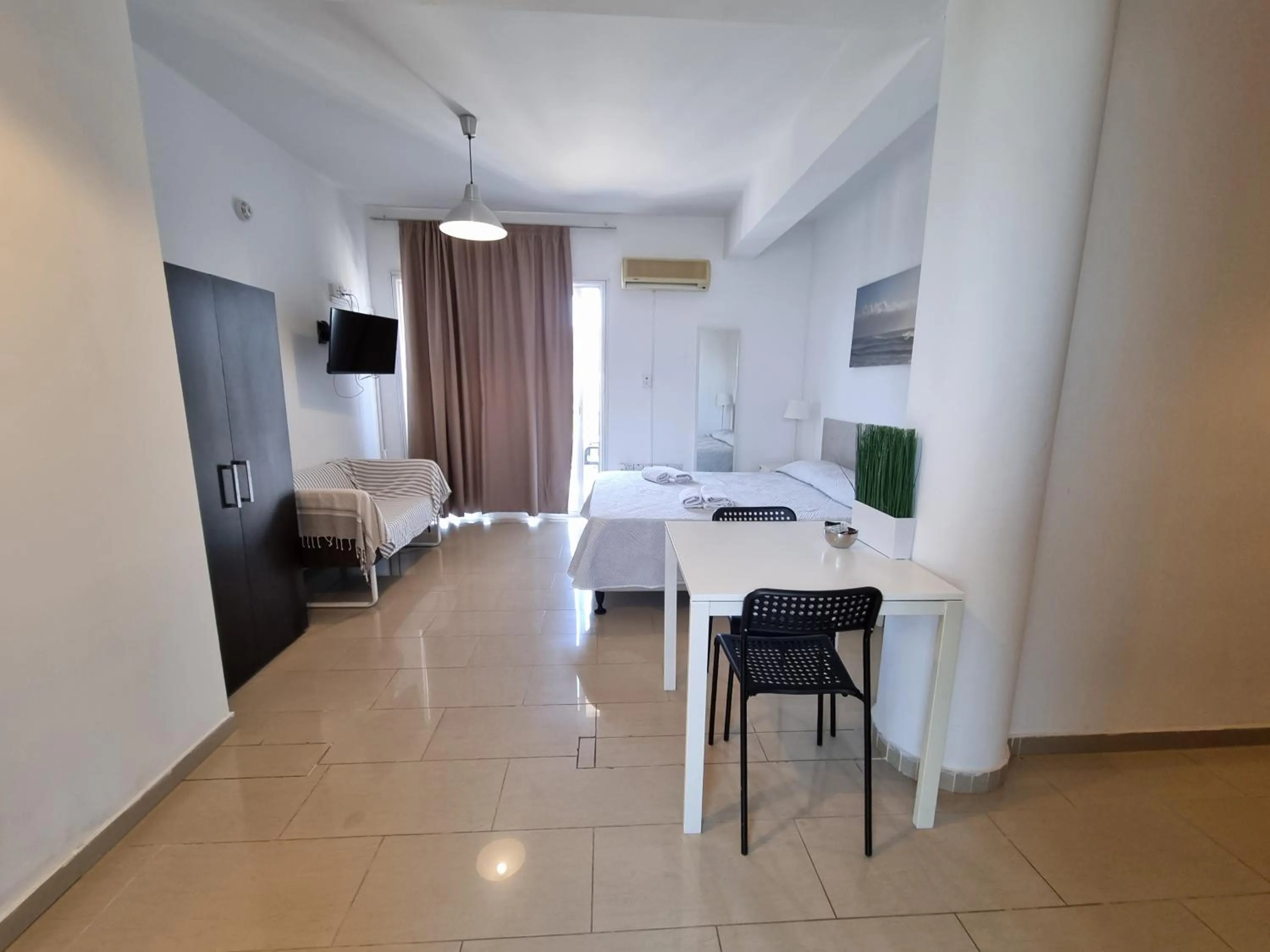 Bed in Valentinos Apartments