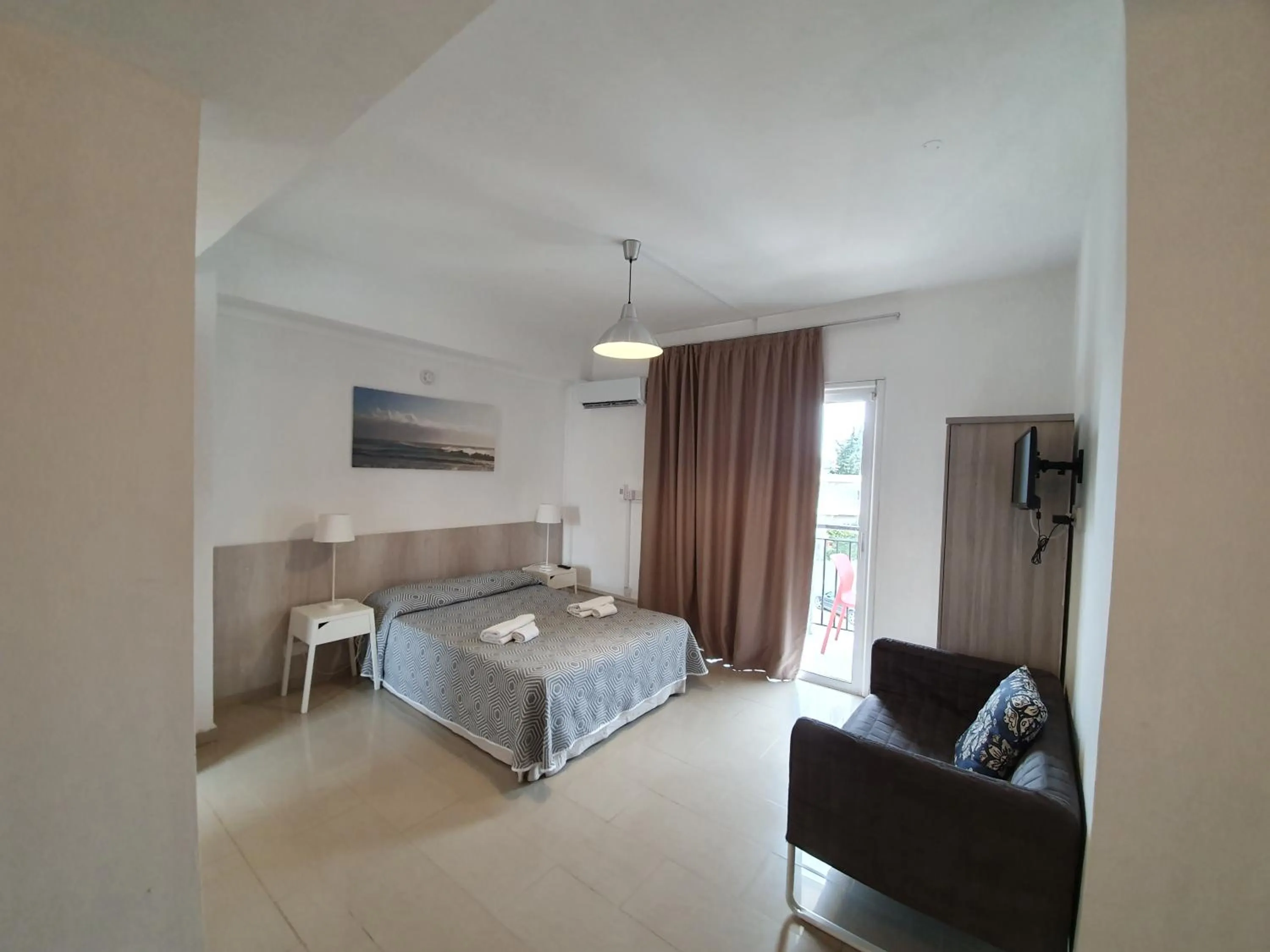 Bed in Valentinos Apartments