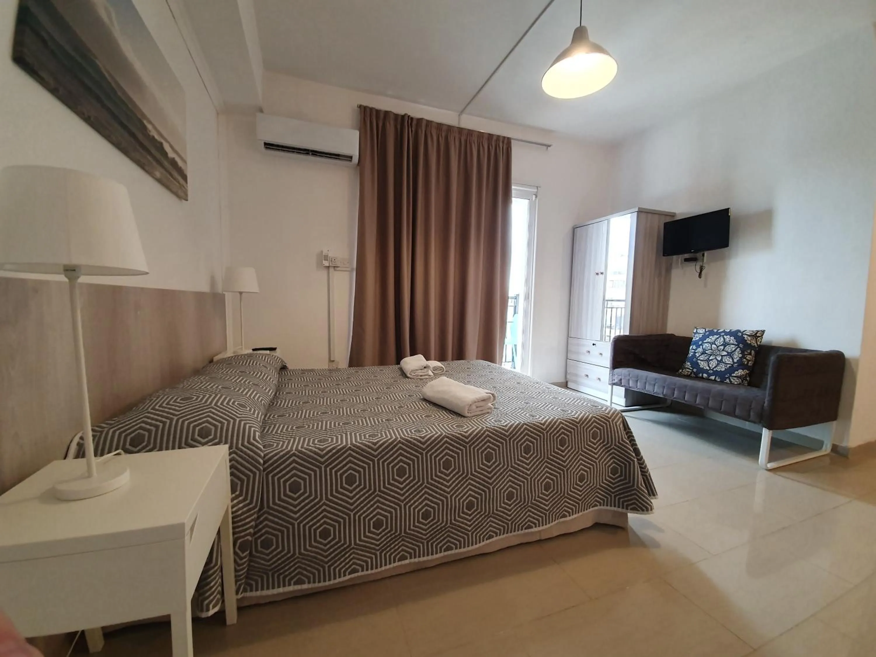 Bed in Valentinos Apartments