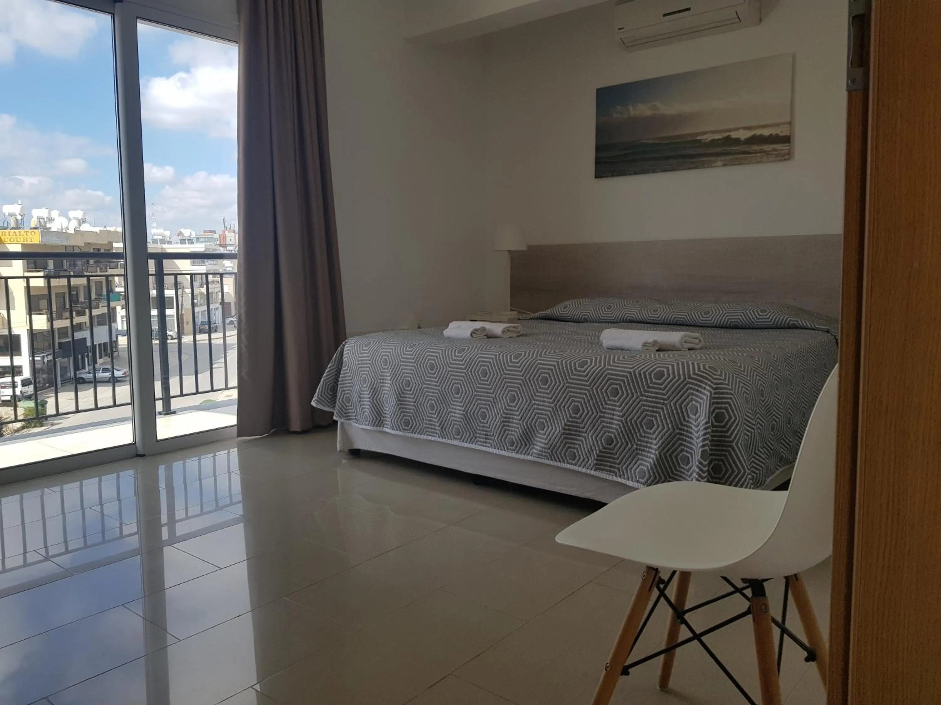 Bed in Valentinos Apartments