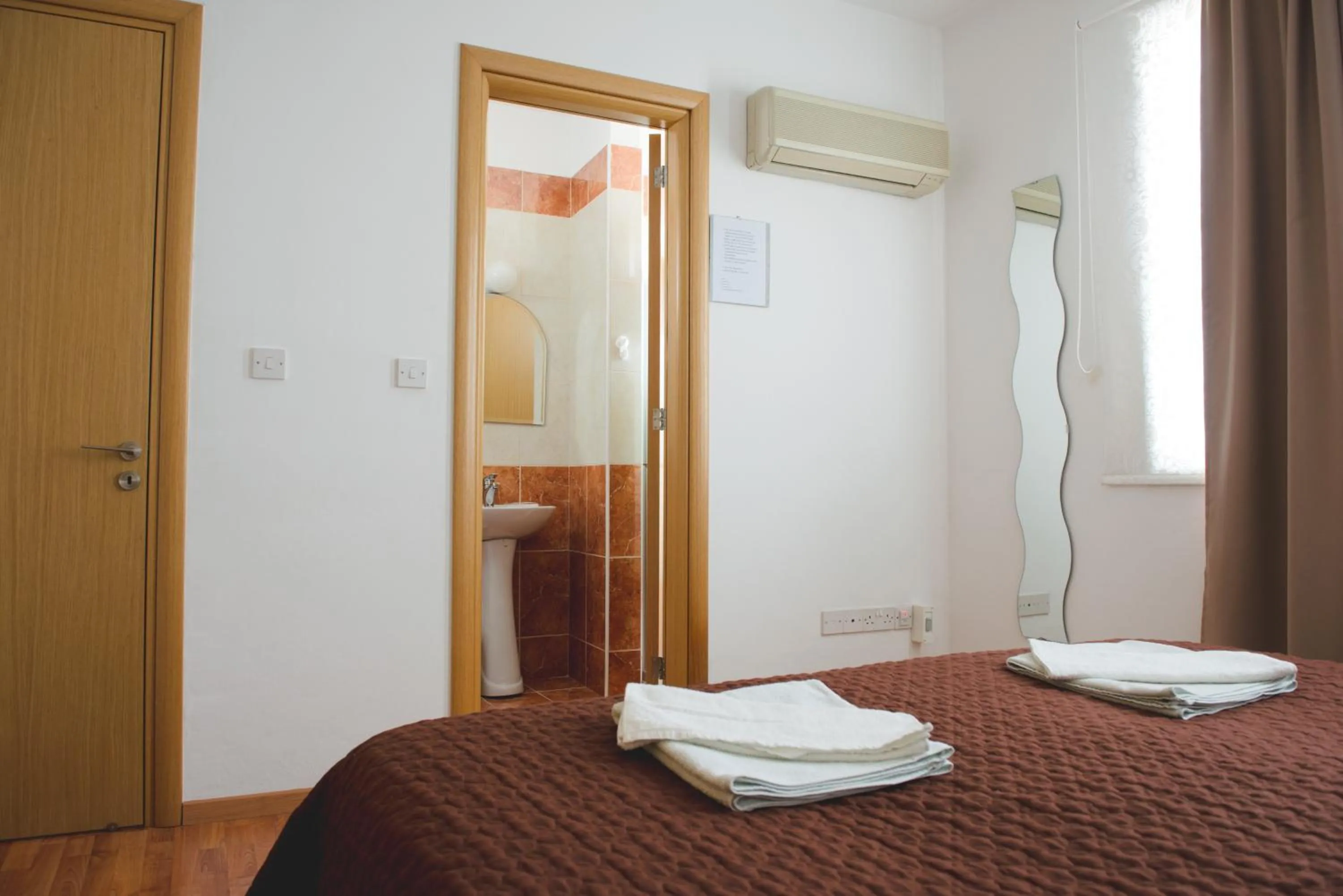 Toilet, Bed in Valentinos Apartments