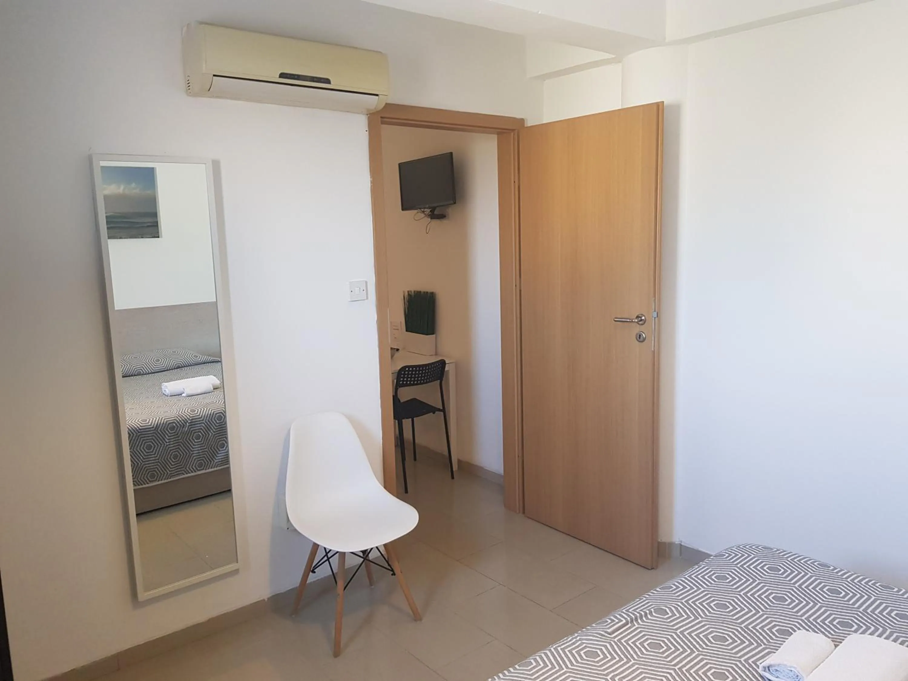 Bed in Valentinos Apartments