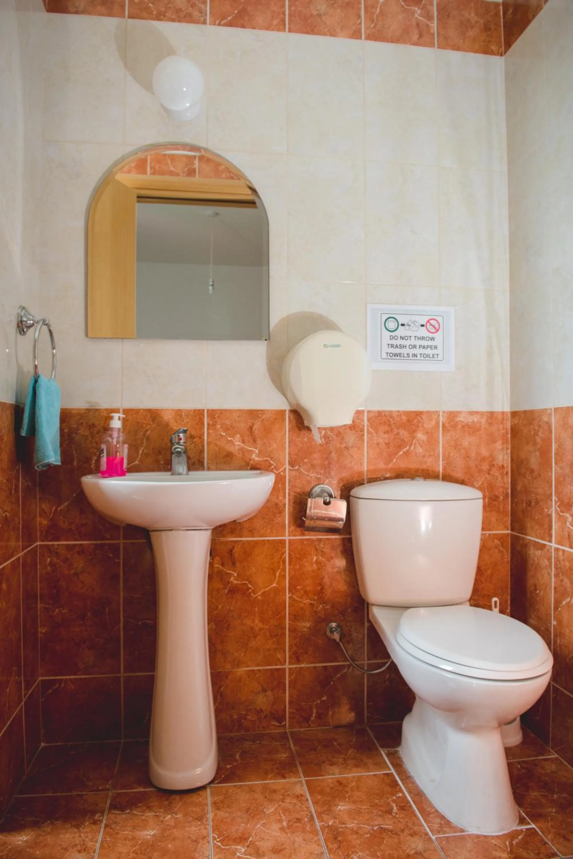 Toilet in Valentinos Apartments