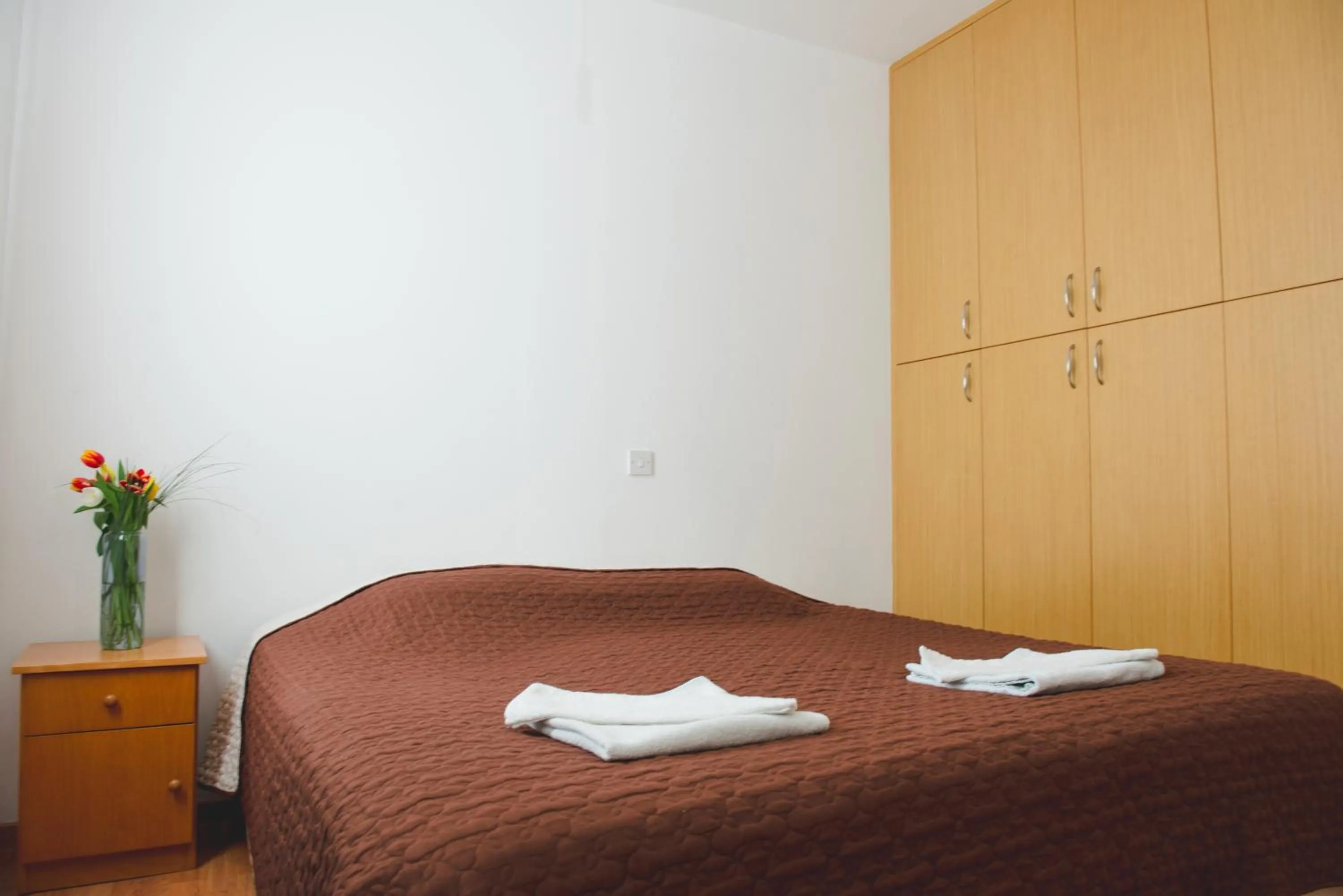 Bed in Valentinos Apartments