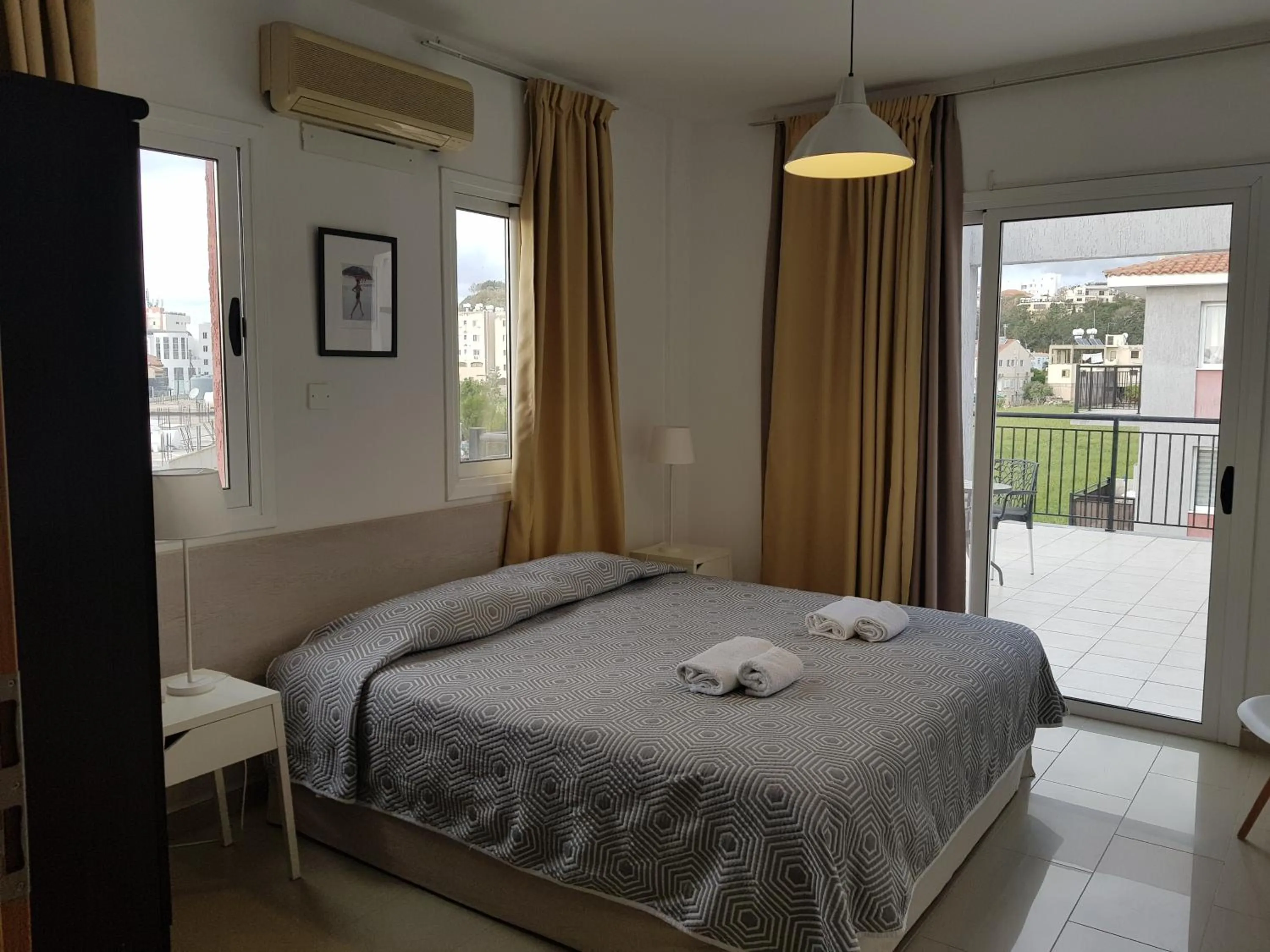 Bed in Valentinos Apartments