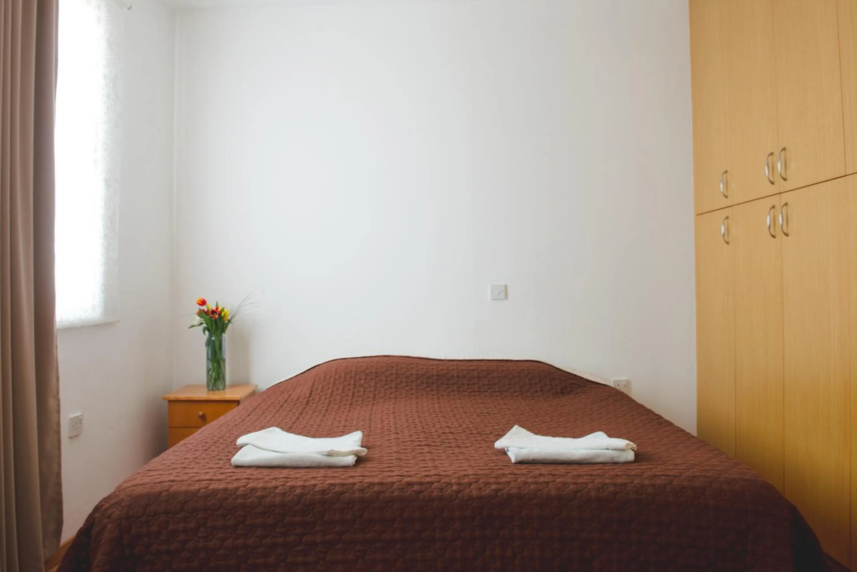 Bed in Valentinos Apartments