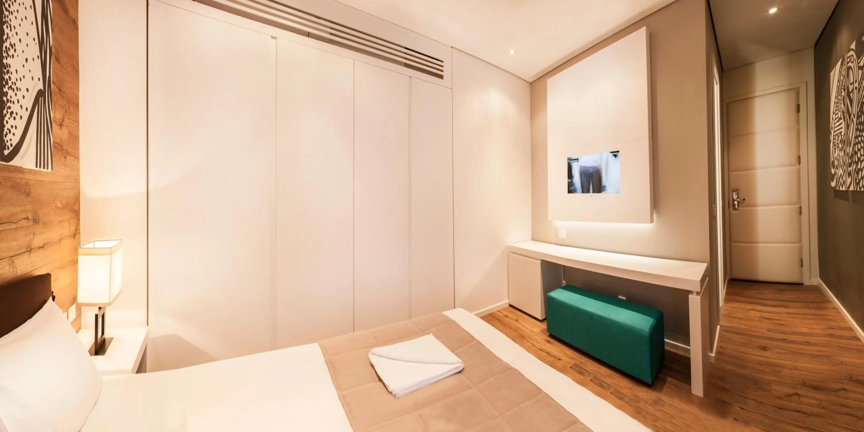 Bed in Eden Garden Suites