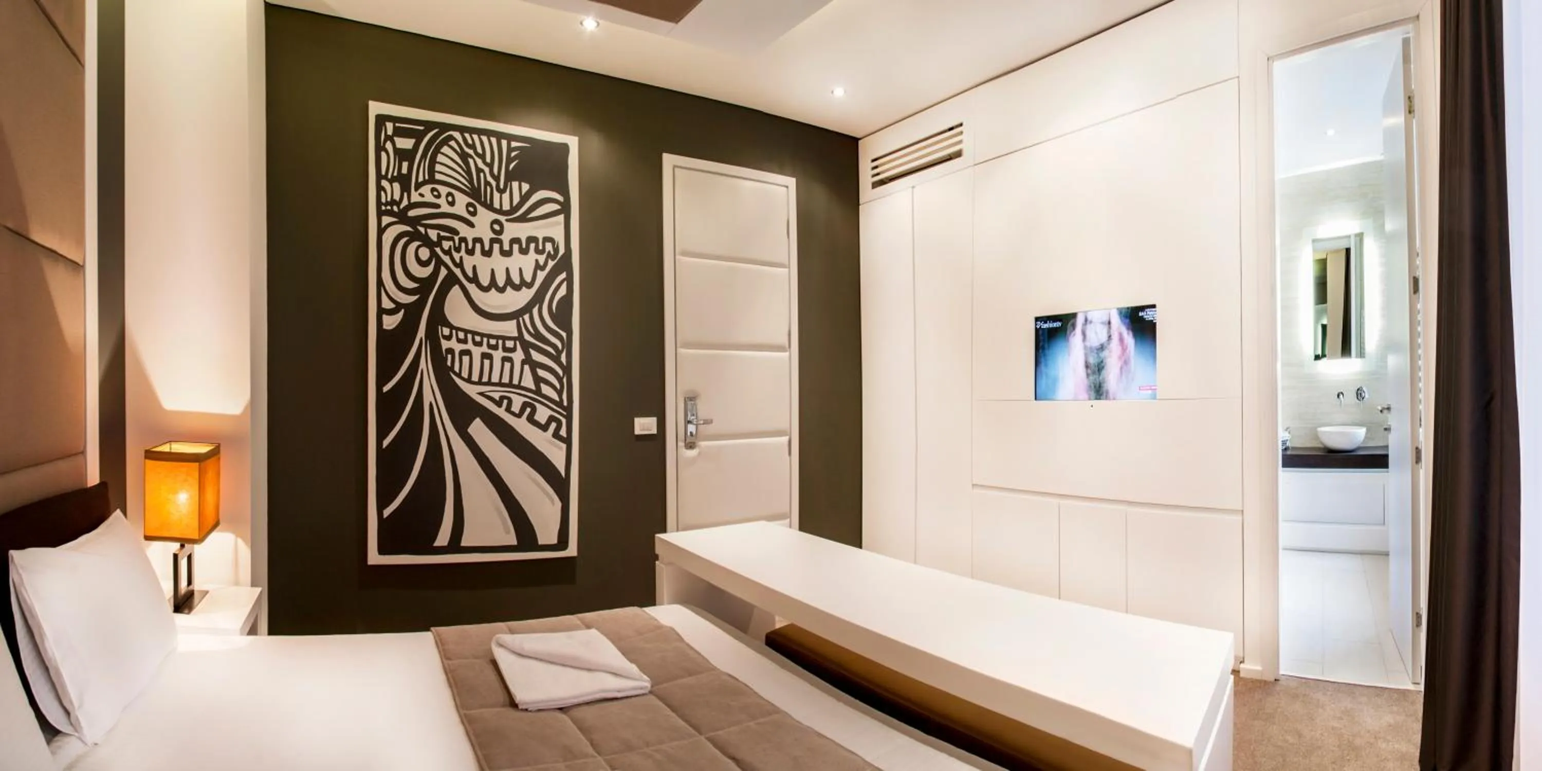 Bed in Eden Garden Suites