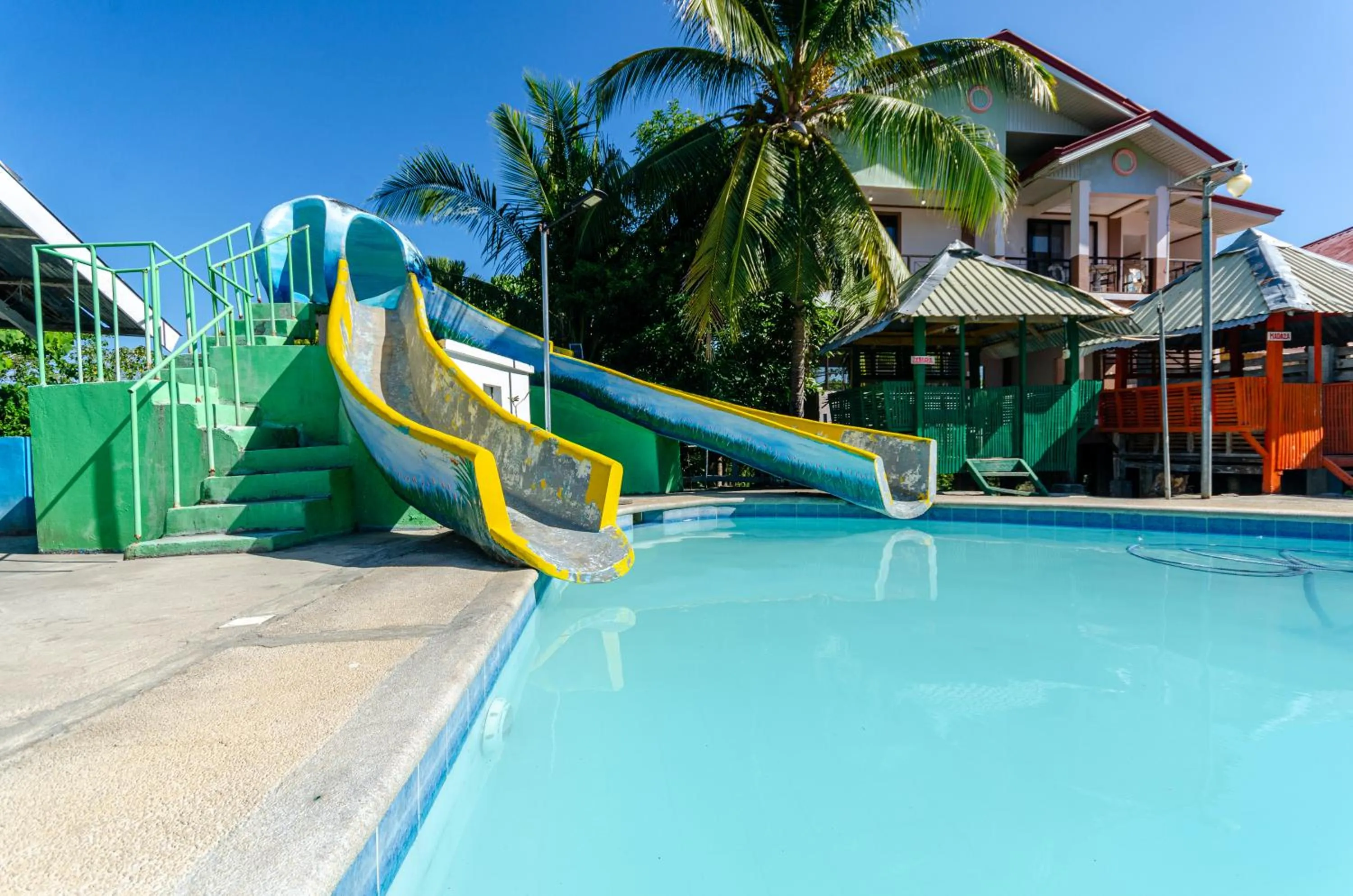 Swimming pool in Magsaysay Hillside Resort powered by Cocotel