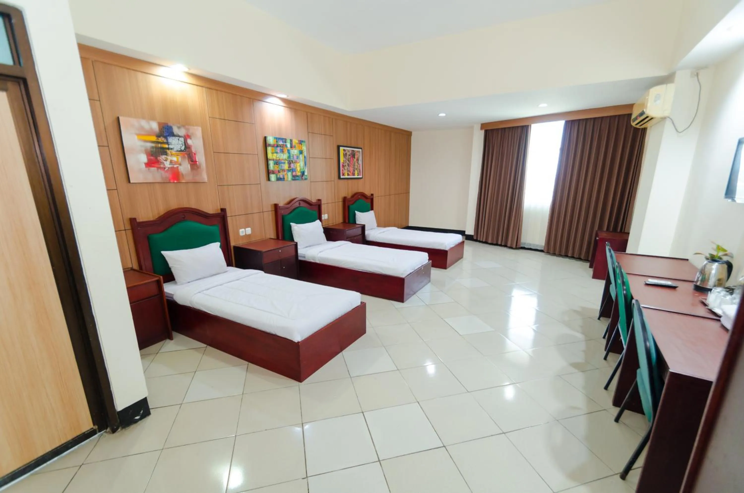 Bed in Graha Widya Bhakti at STIESIA Surabaya